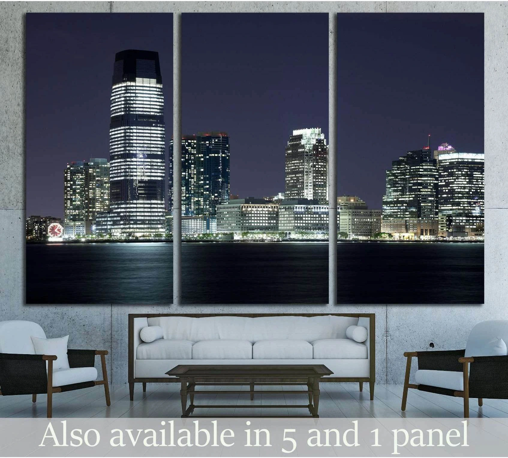 Jersey City night skyline canvas print over the Hudson River displayed as a triptych above a sofa