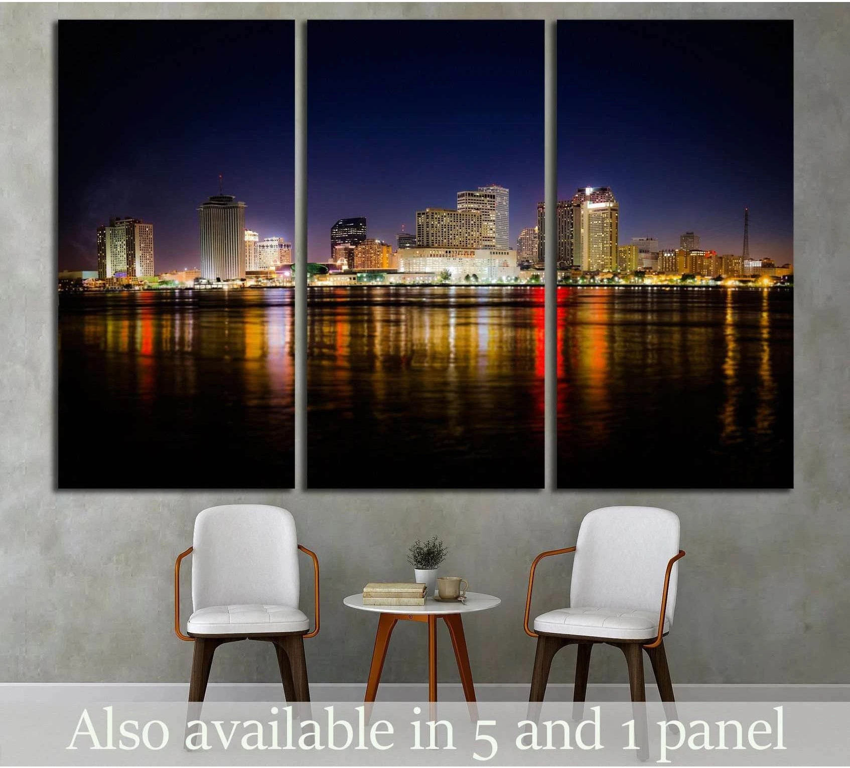 New Orleans skyline at night canvas print with glowing river reflections in a triptych layout above chairs