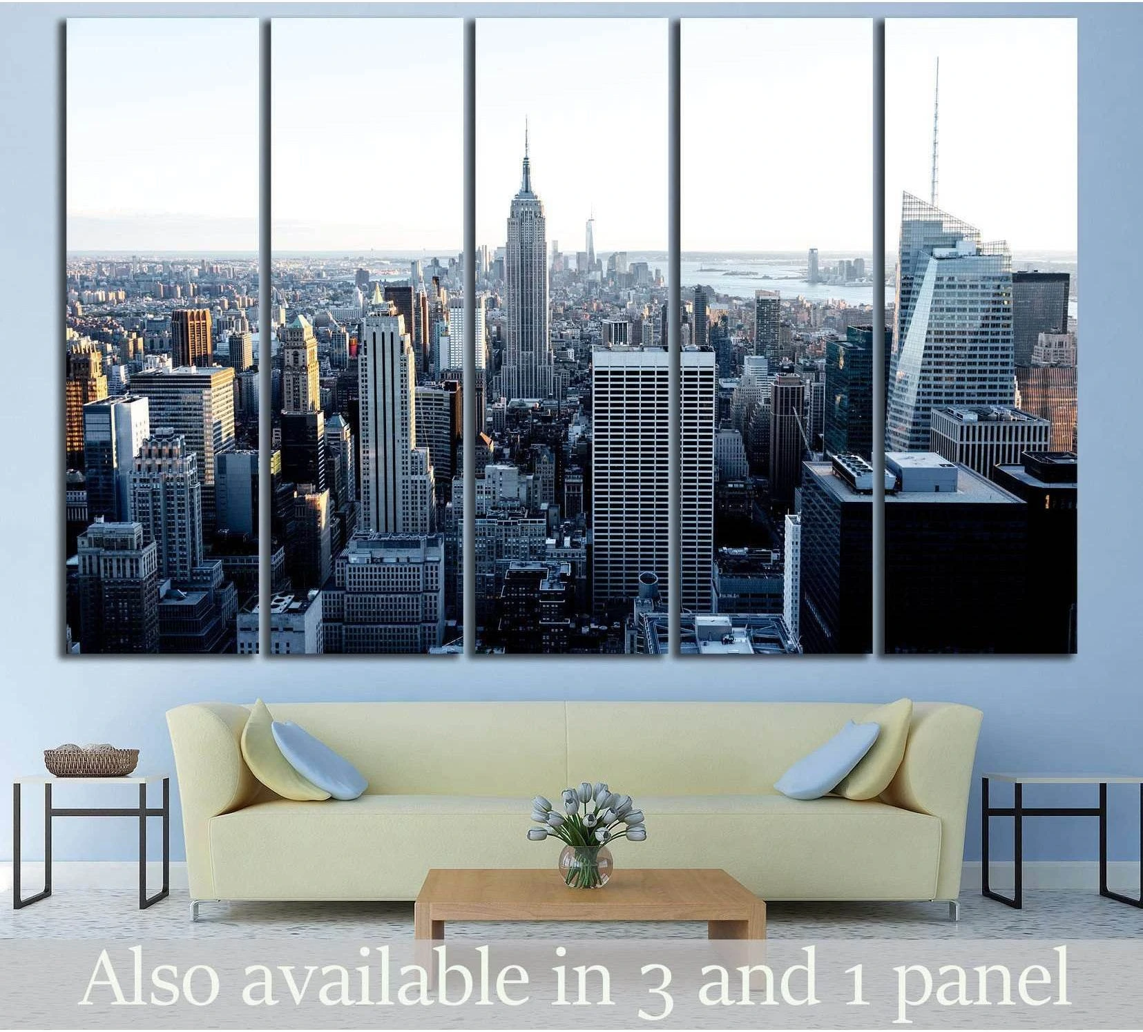 Empire State Building and New York skyline multi-panel canvas print above sofa in modern living room