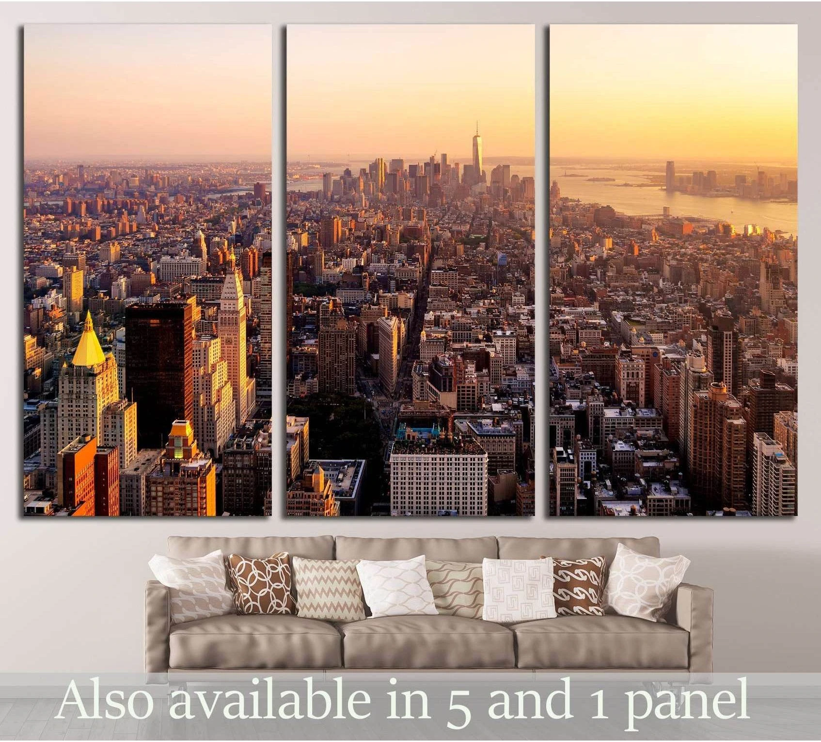 Triptych NYC skyline canvas print at sunset above a sofa in a modern living room