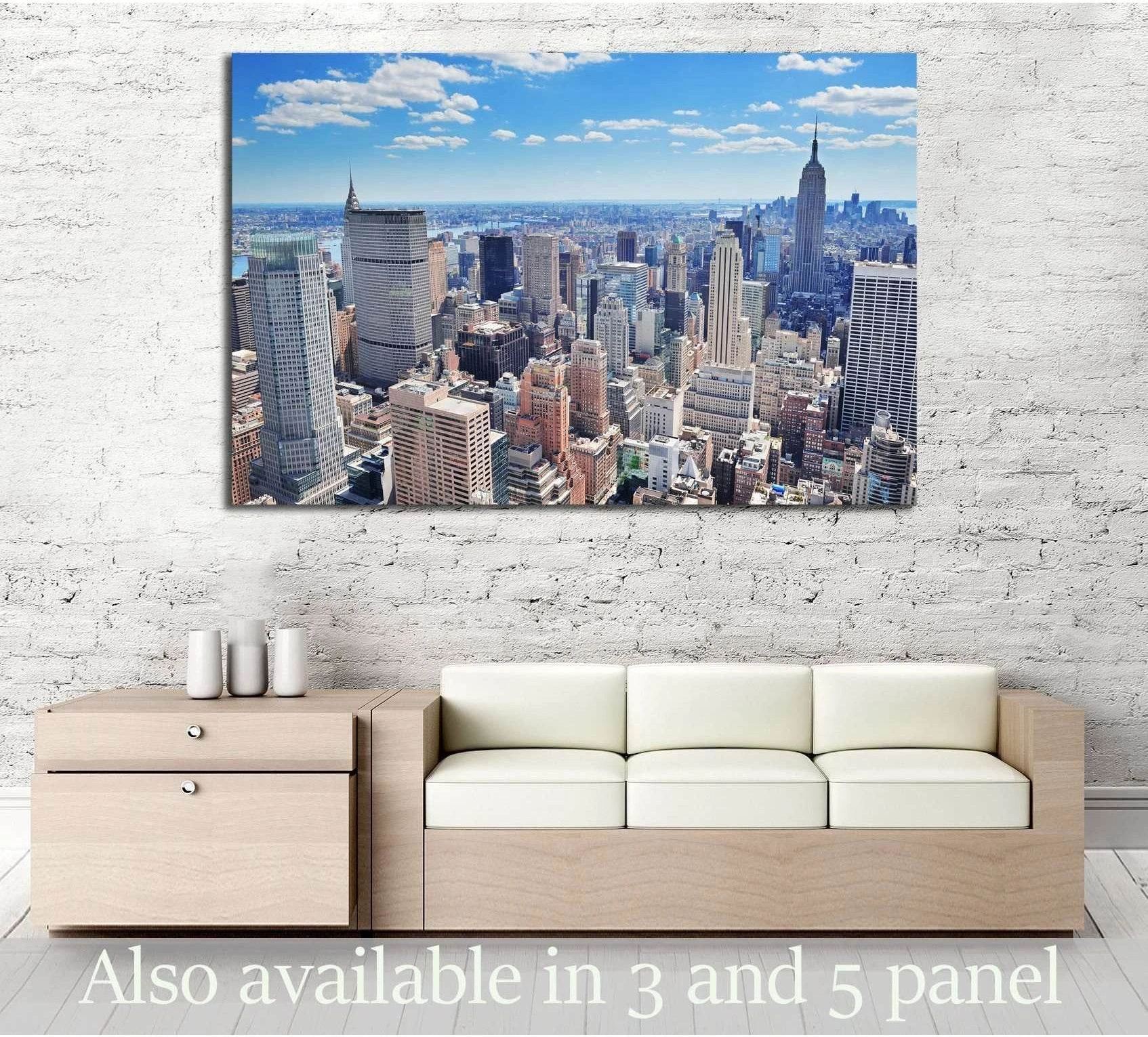 Aerial Midtown Manhattan skyline canvas print hung above a sofa in a modern living room