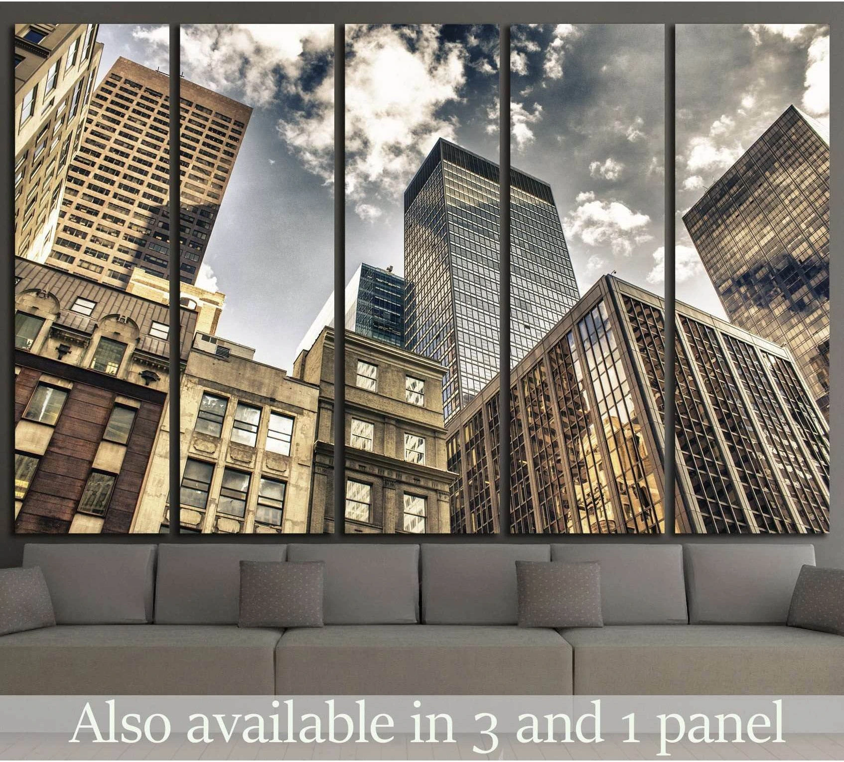 New York City Manhattan skyline canvas print in sepia tones above a sofa in a modern living room