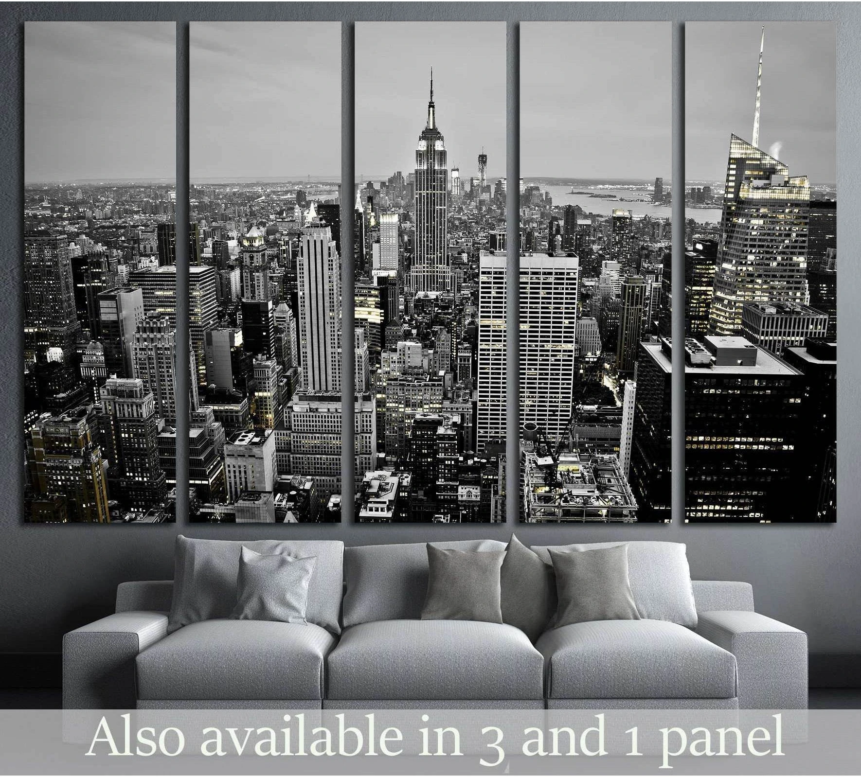Black and white NYC skyline canvas print in five panels above a sofa in a modern living room