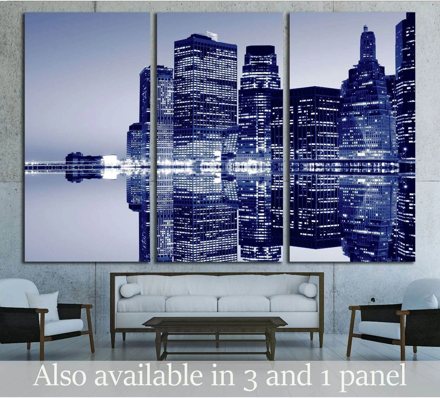 Blue New York City skyline canvas print with mirrored water reflection above sofa in modern living room