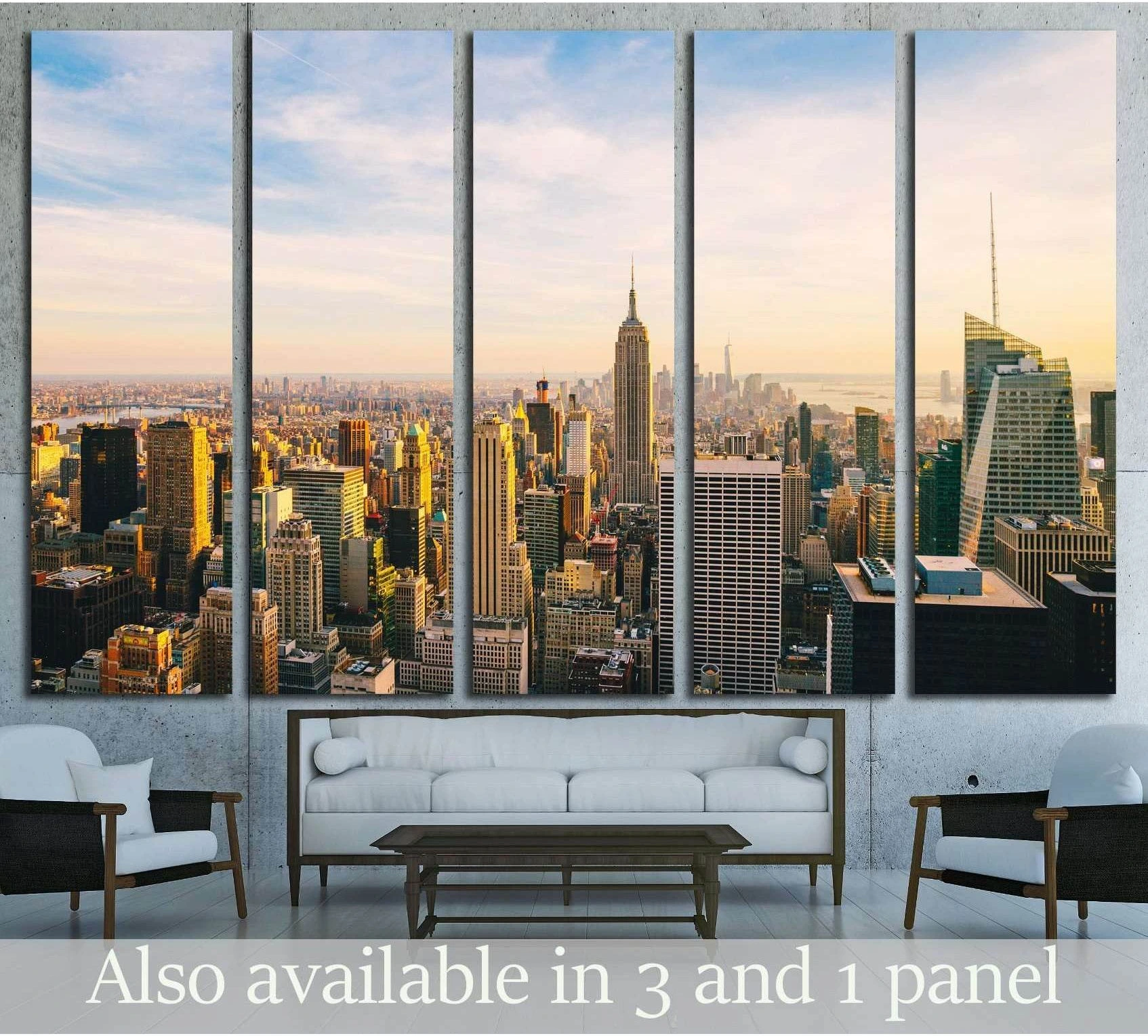 Five-panel New York City skyline canvas print at sunset hung above a sofa in a modern living room