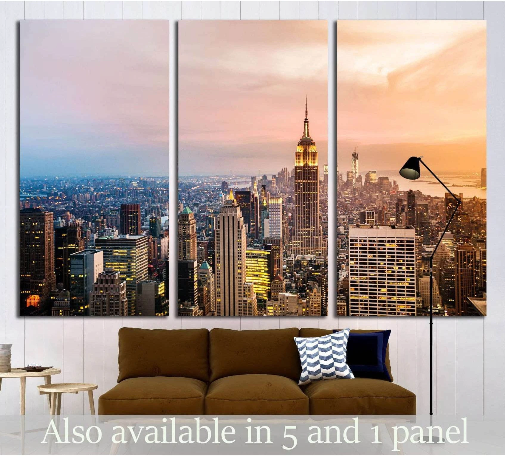 Triptych NYC skyline canvas print with Empire State Building at sunset above a sofa