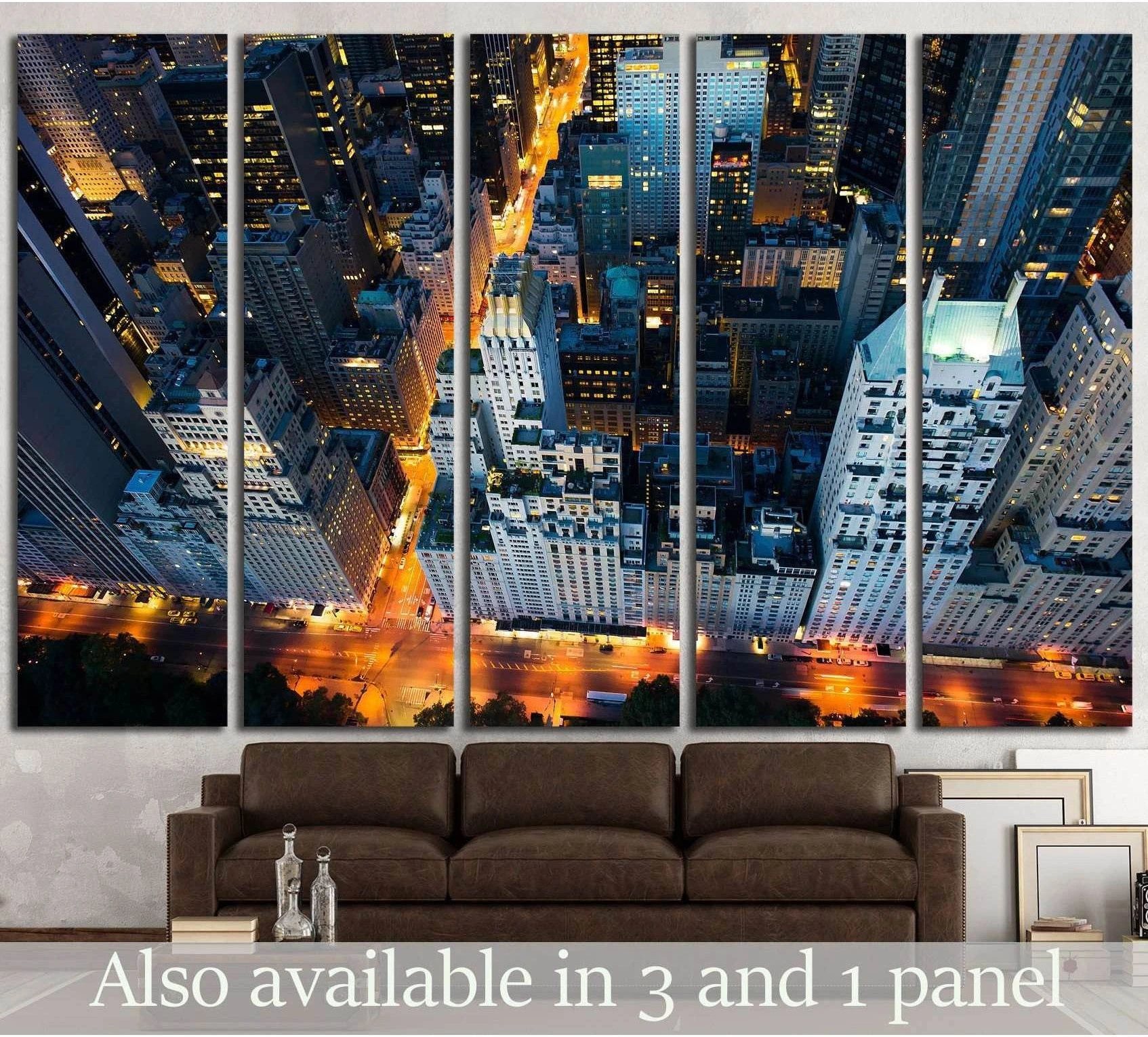 NYC aerial canvas print with Central Park edge and glowing streets above a brown sofa