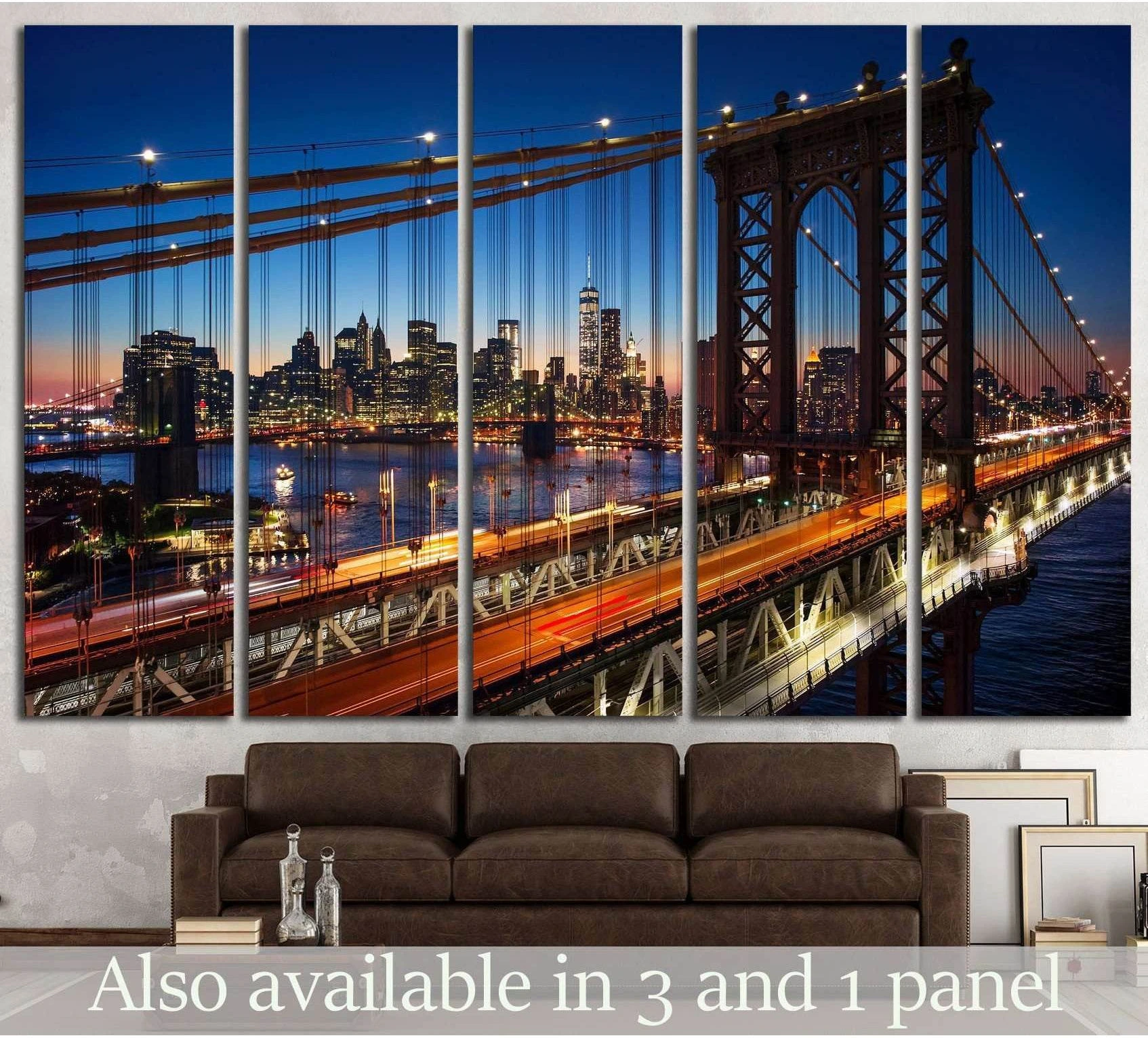 Manhattan Bridge and NYC skyline canvas print at dusk hung above a sofa in a modern living room