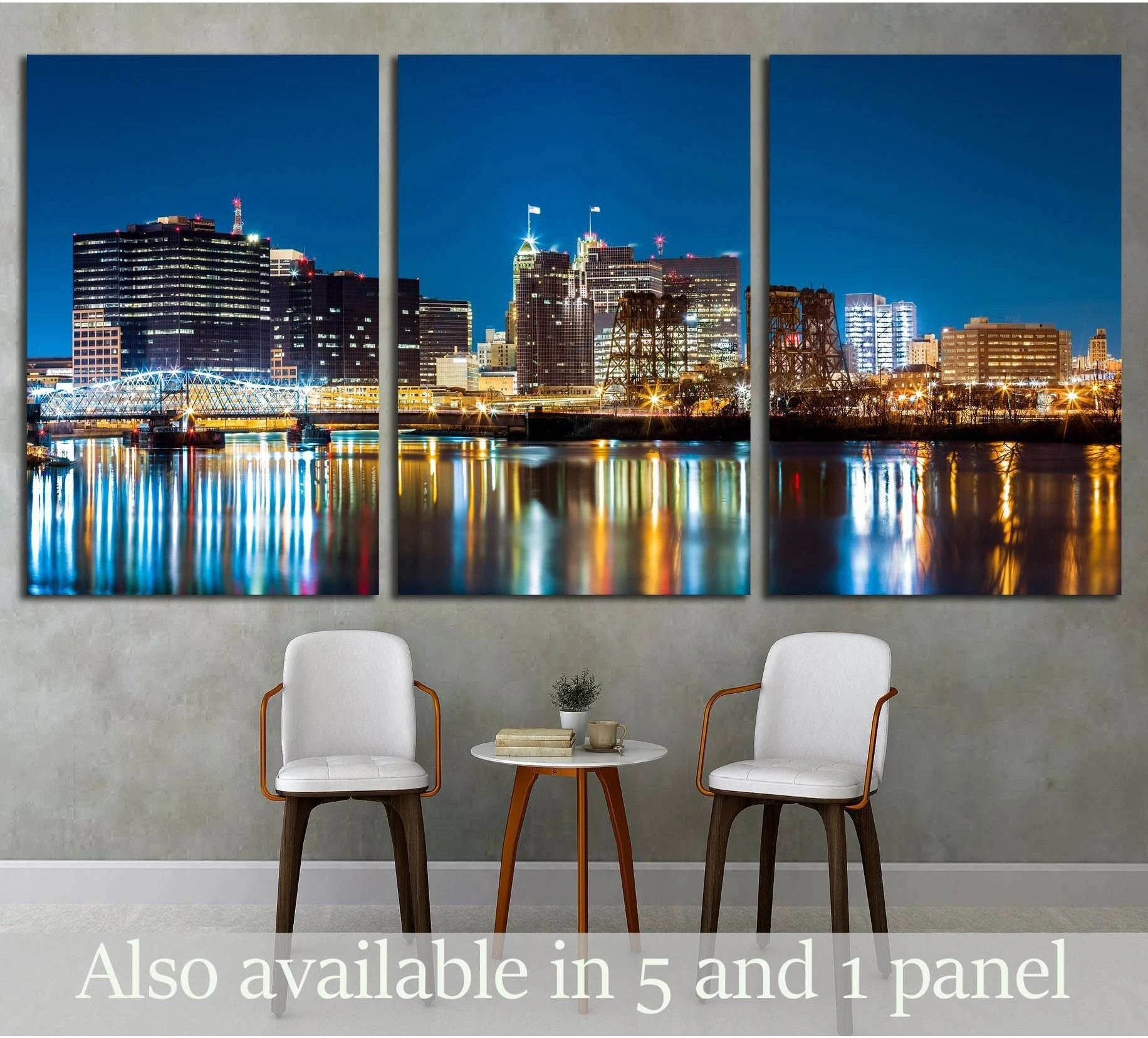 Triptych Newark skyline canvas print with night reflections above chairs in a modern waiting room