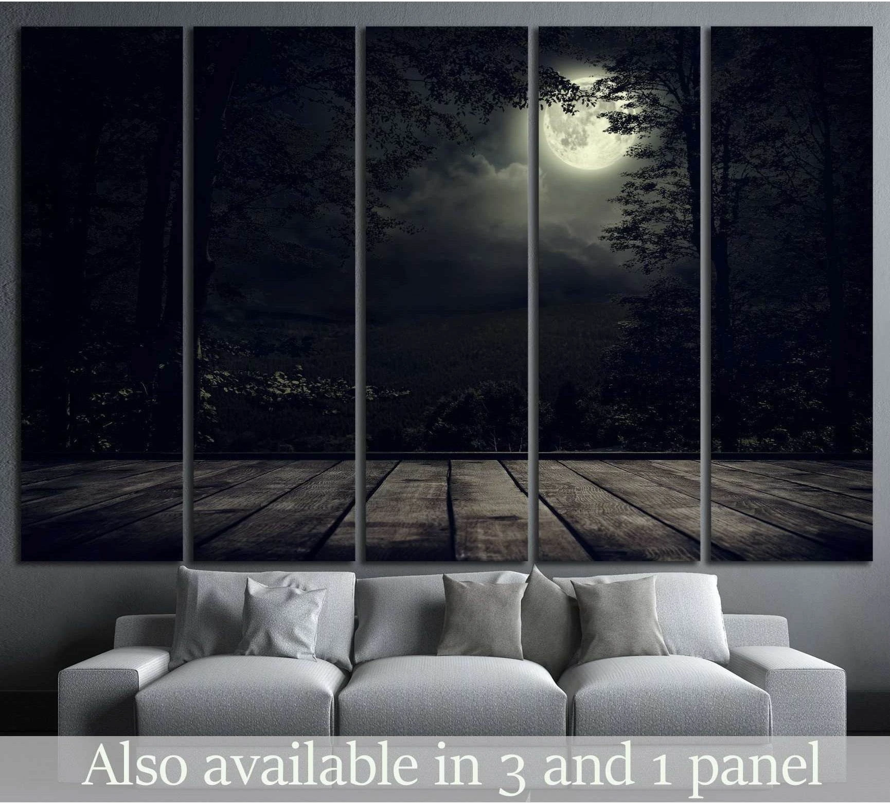 Moonlit mountain forest canvas print with glowing full moon above sofa in a dark modern living room