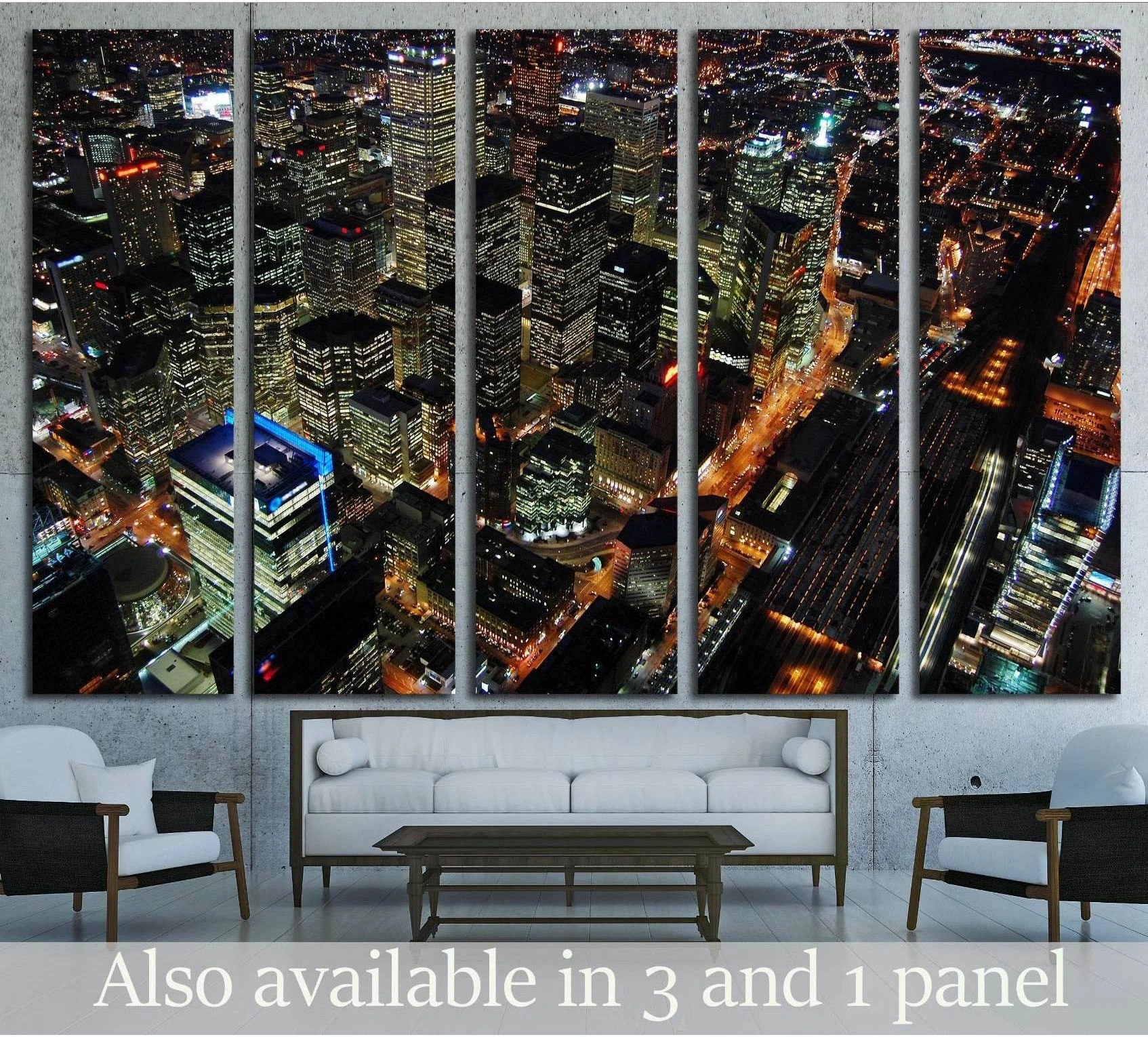 Toronto skyline canvas print with aerial night view of downtown towers above a modern living room sofa