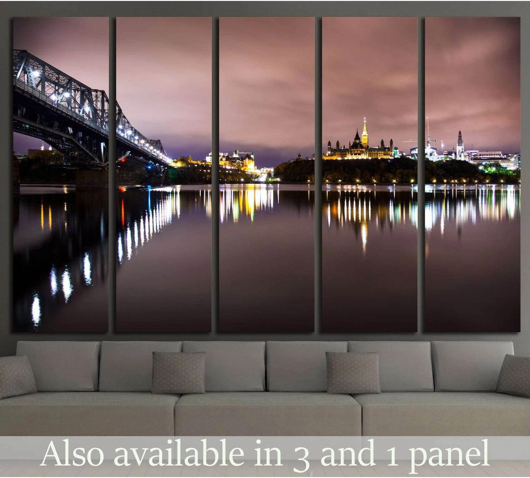 Quebec City skyline canvas print with Alexandra Bridge at night above a sofa in modern living room