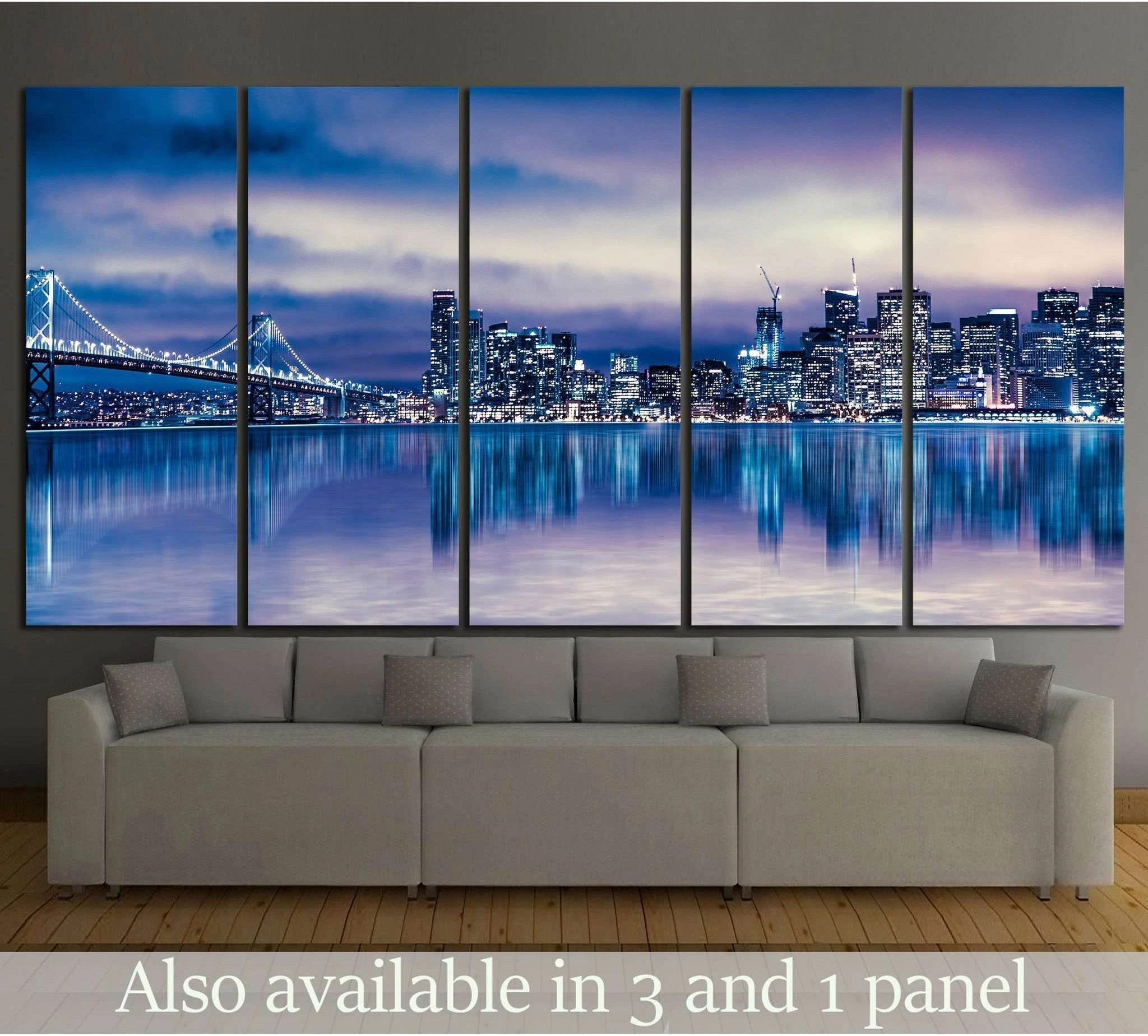 San Francisco skyline canvas print with Bay Bridge at night above sofa in a modern living room