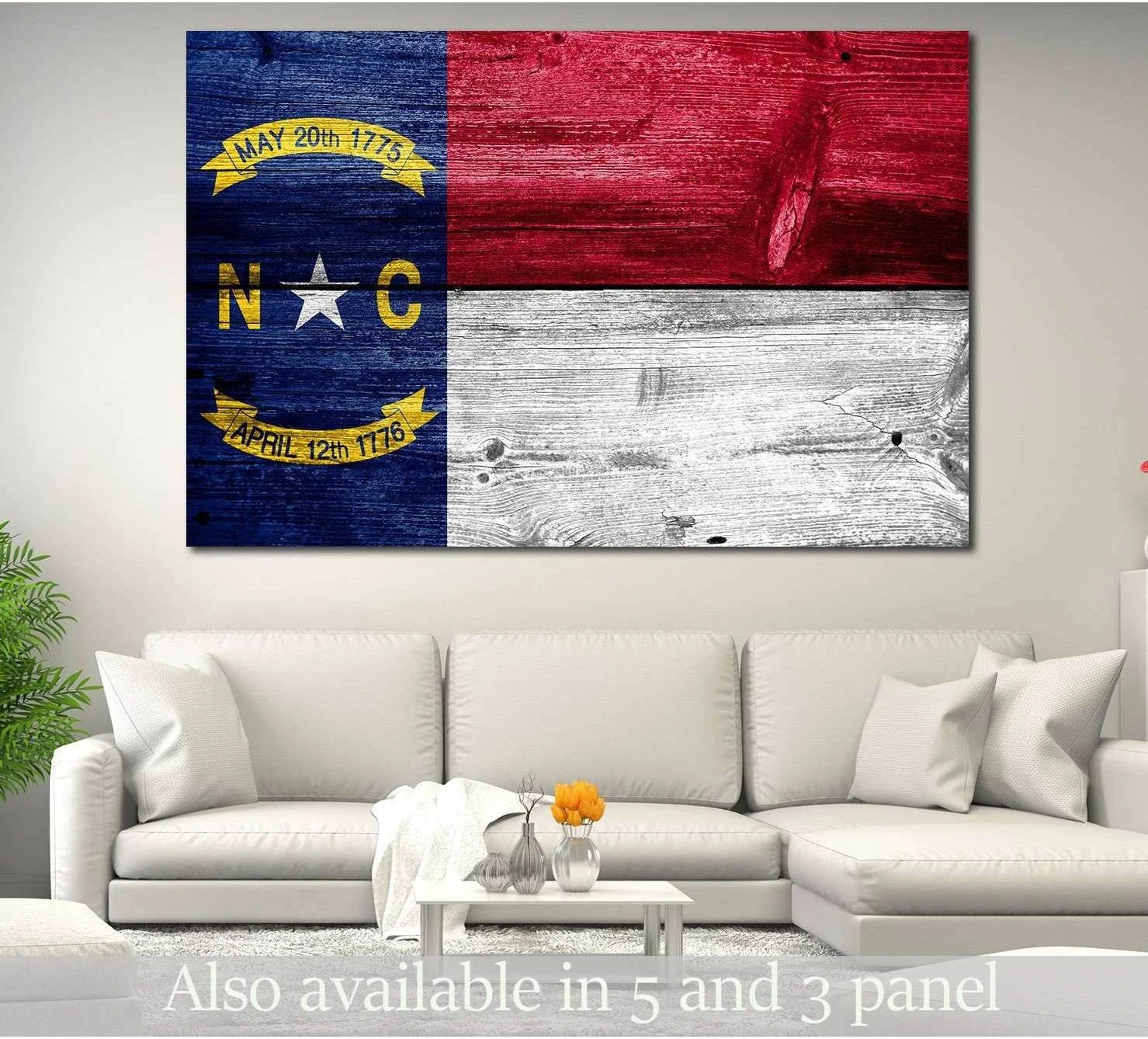 North Carolina state flag canvas print on rustic wood wall above a white sofa