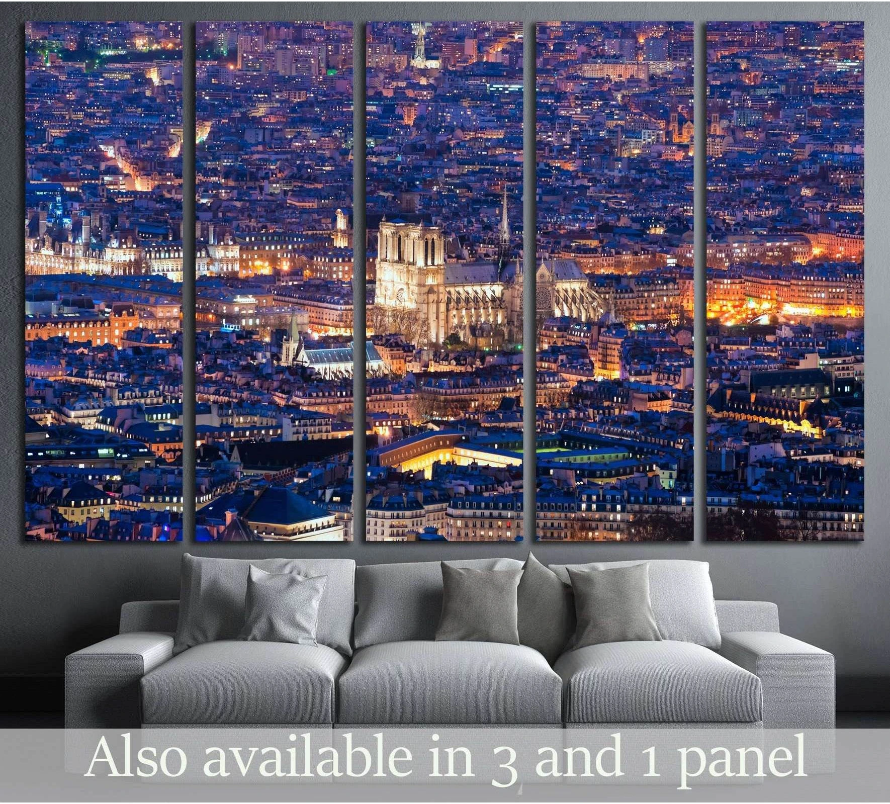 Notre Dame Paris night canvas print in a five-panel cityscape mockup above a gray sofa