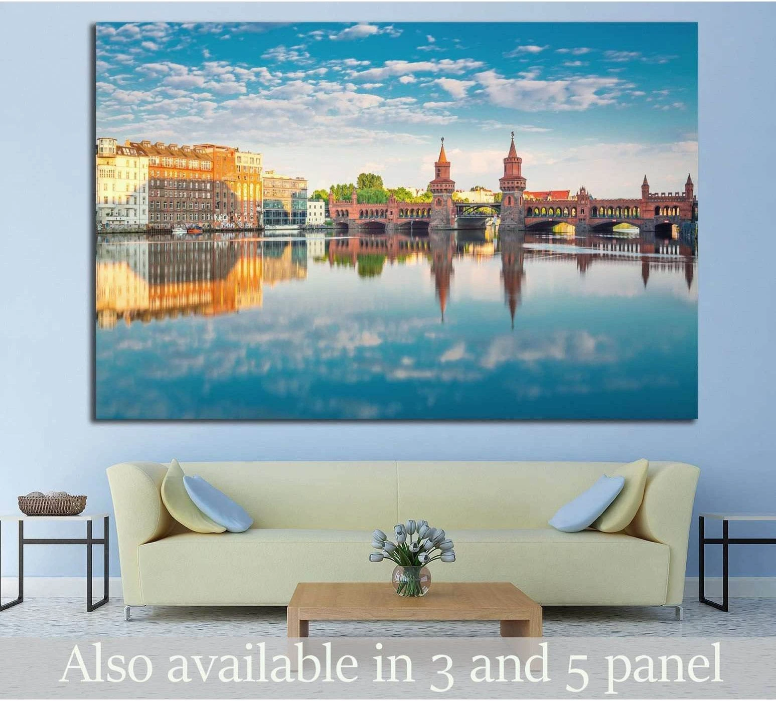 Oberbaum Bridge Berlin canvas print with warm riverside buildings reflected in calm water above a sofa
