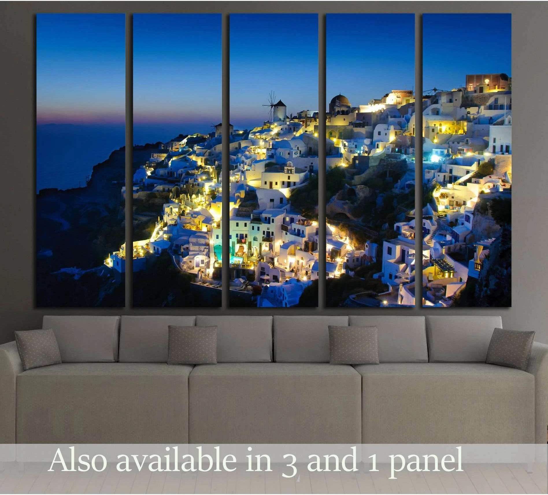 Oia village Santorini canvas print at dusk hung above sofa in a modern living room