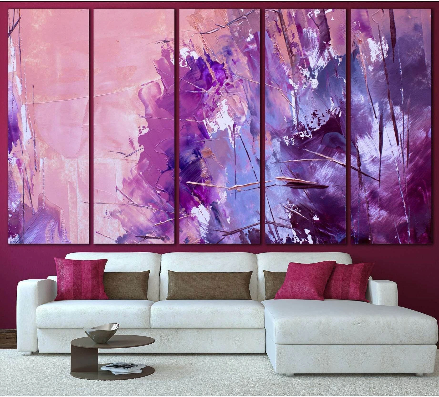 Lavender and plum abstract multi-panel canvas print above a white sofa in a modern living room