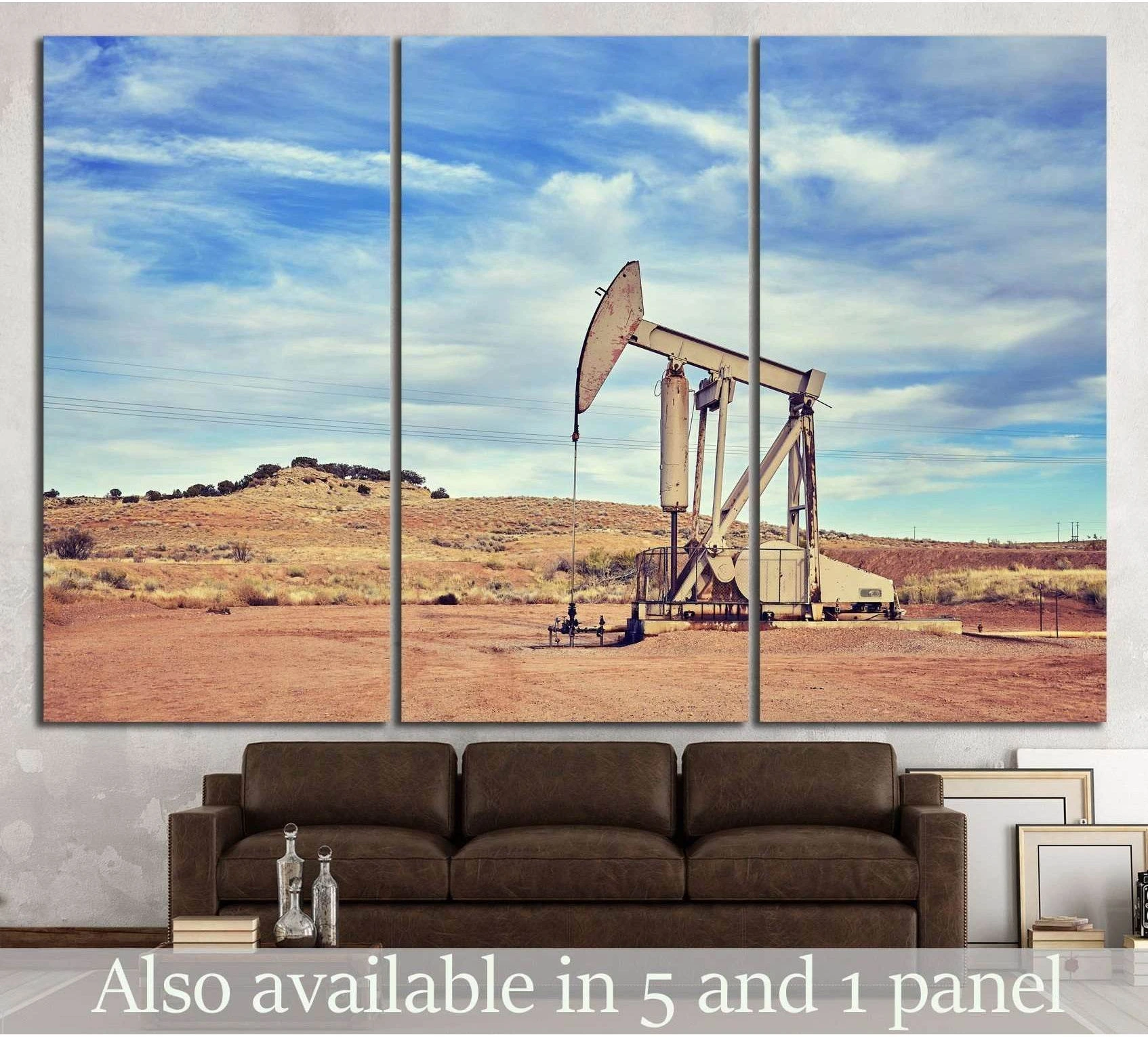 Pumpjack canvas print with oil rig in a dusty desert landscape, displayed above a sofa