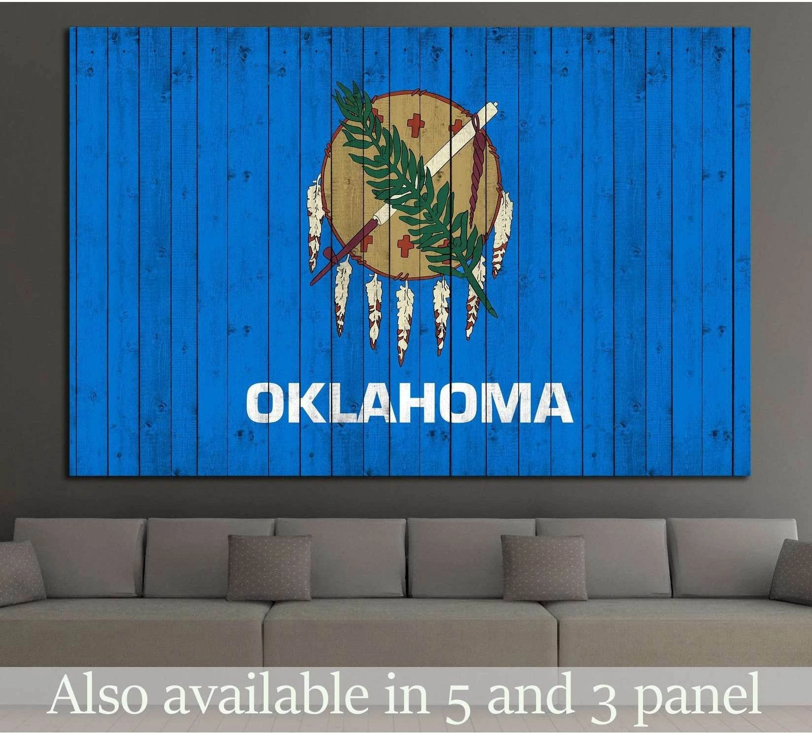 Oklahoma flag canvas print on distressed blue wood planks displayed above a gray sofa