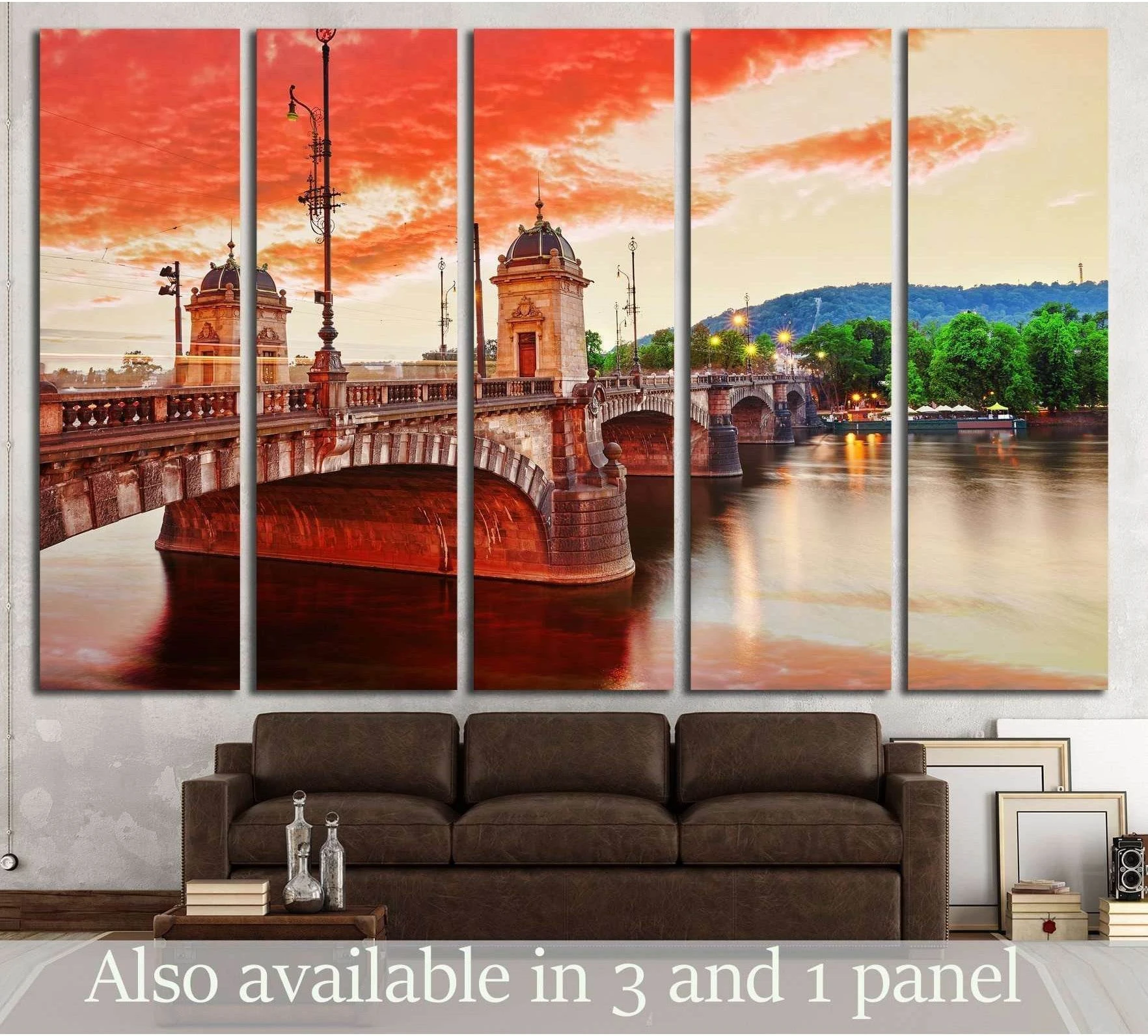Prague bridge canvas print over the Vltava River at sunset, displayed above a sofa in a modern living room