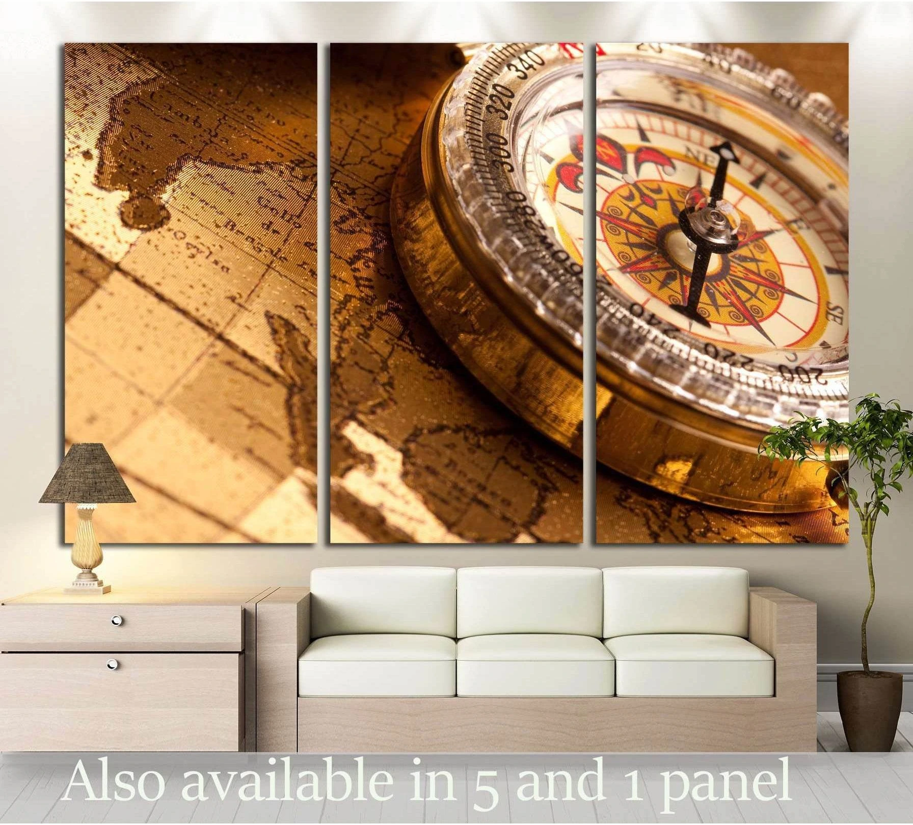 Vintage compass canvas print on an antique map in warm sepia tones, displayed above a sofa
