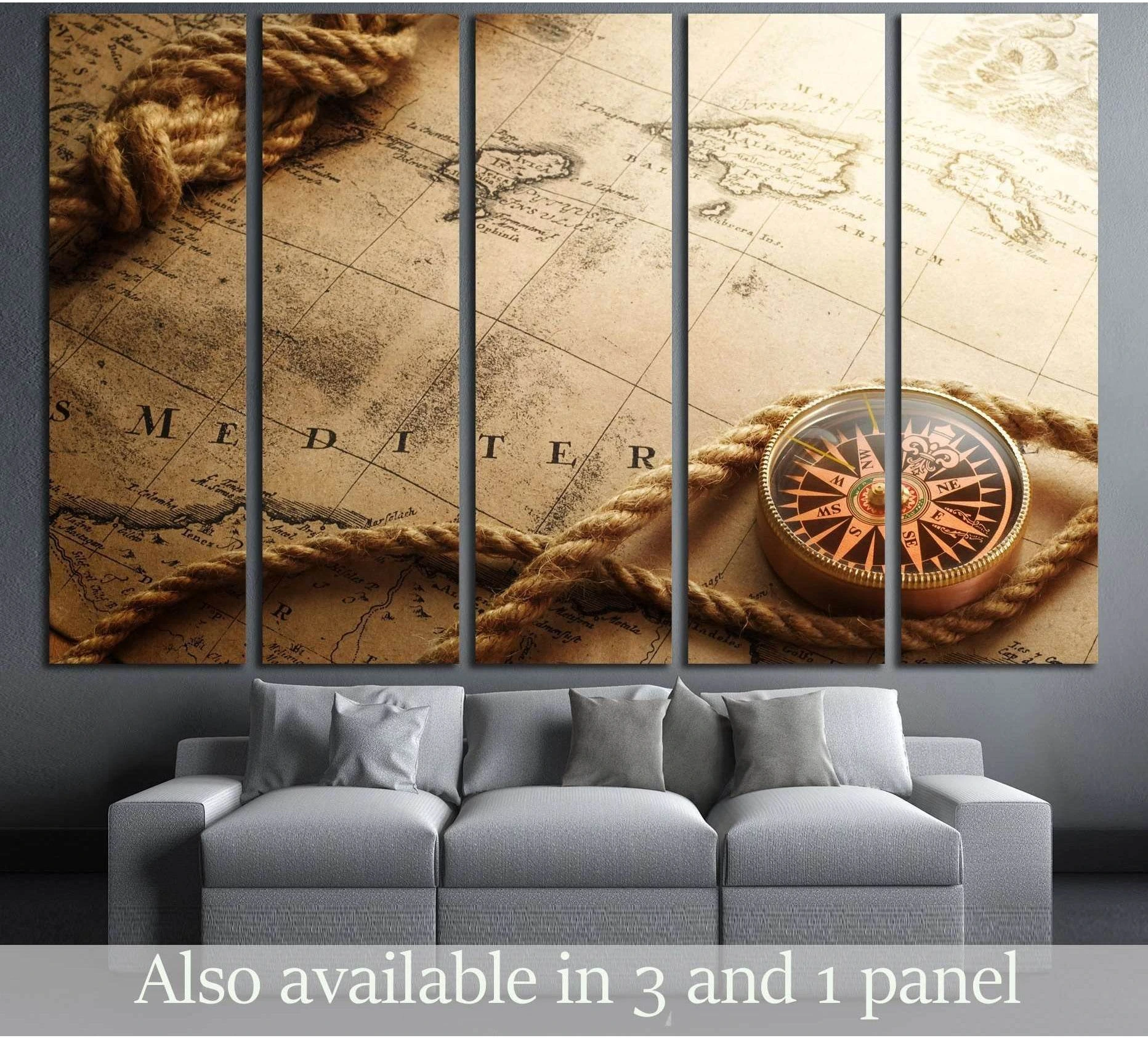 Vintage compass canvas print with antique map and rope, displayed above a gray sofa