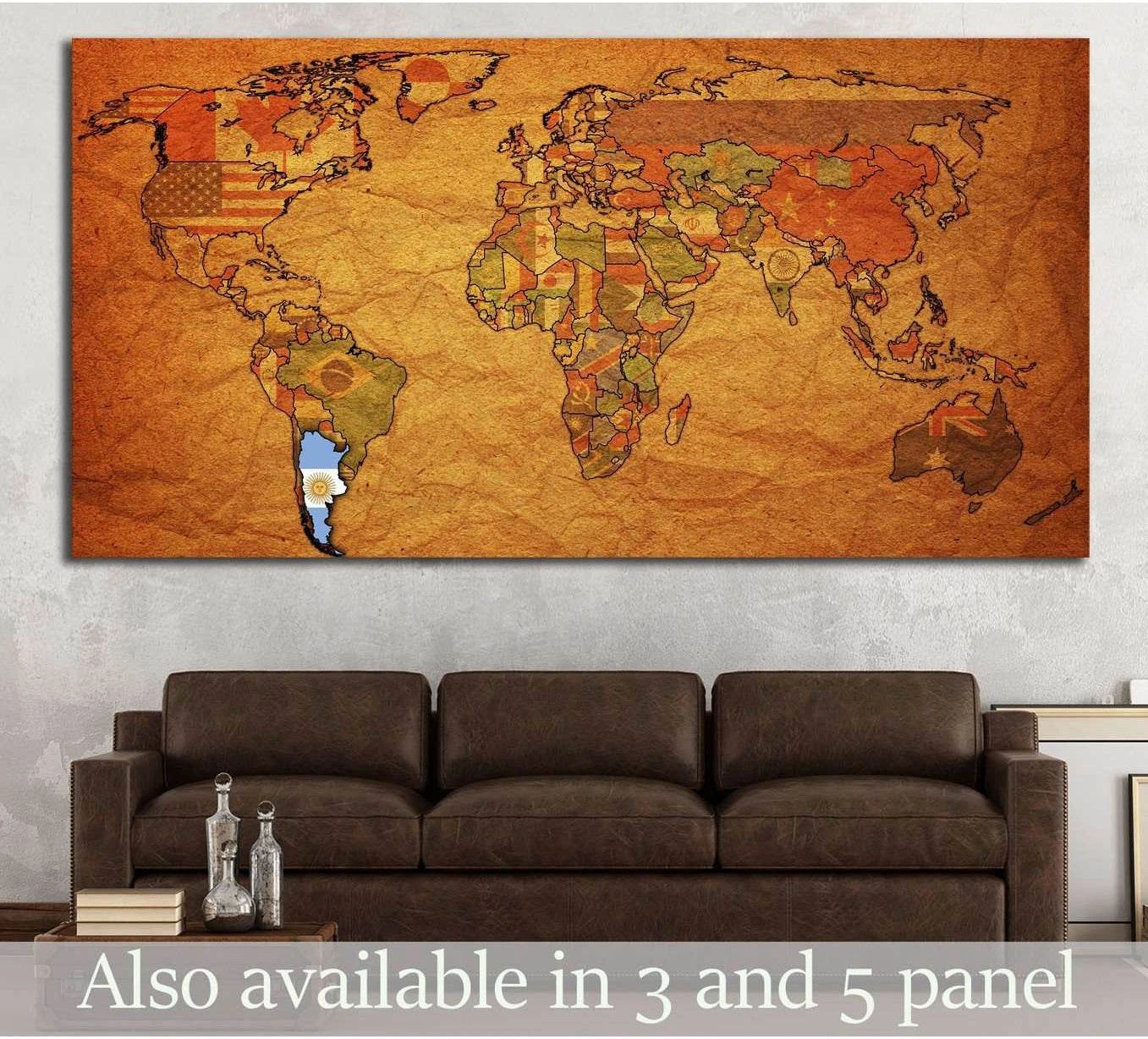 Antique political world map canvas print with country flags above sofa in a rustic office setting