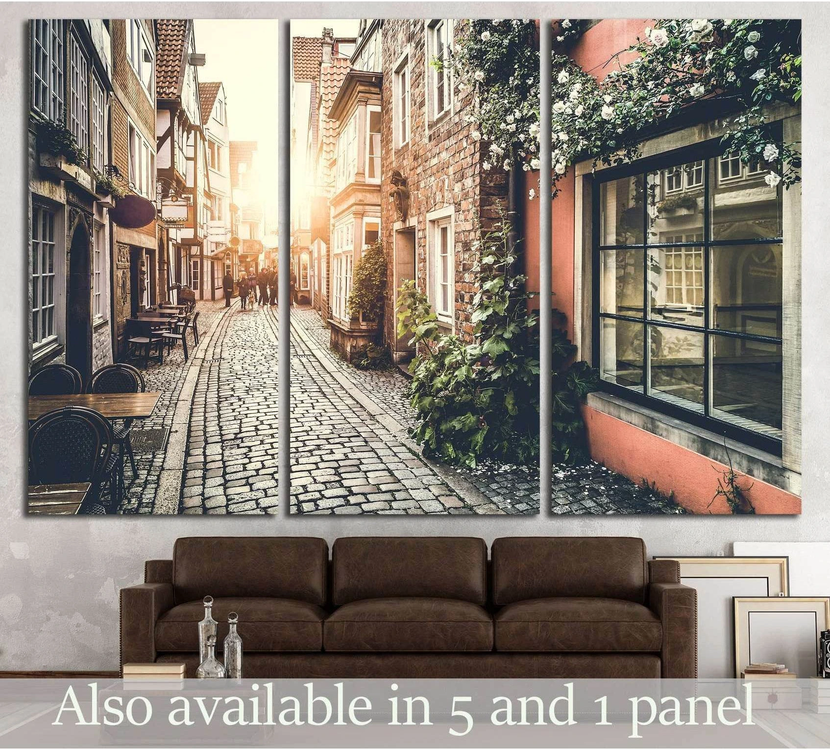 European old town sunset canvas print above sofa with cobblestone street and ivy-covered facades