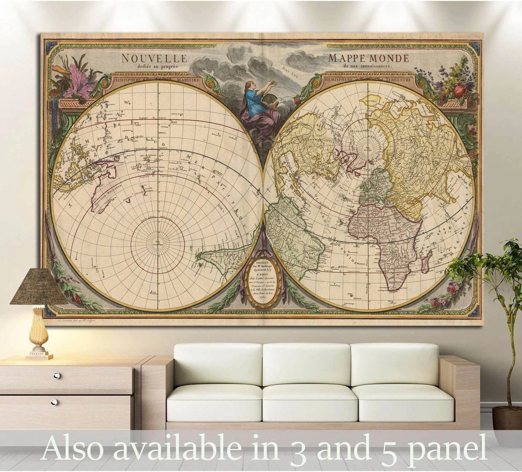 Antique double-hemisphere world map canvas print hung above a sofa in a neutral living room