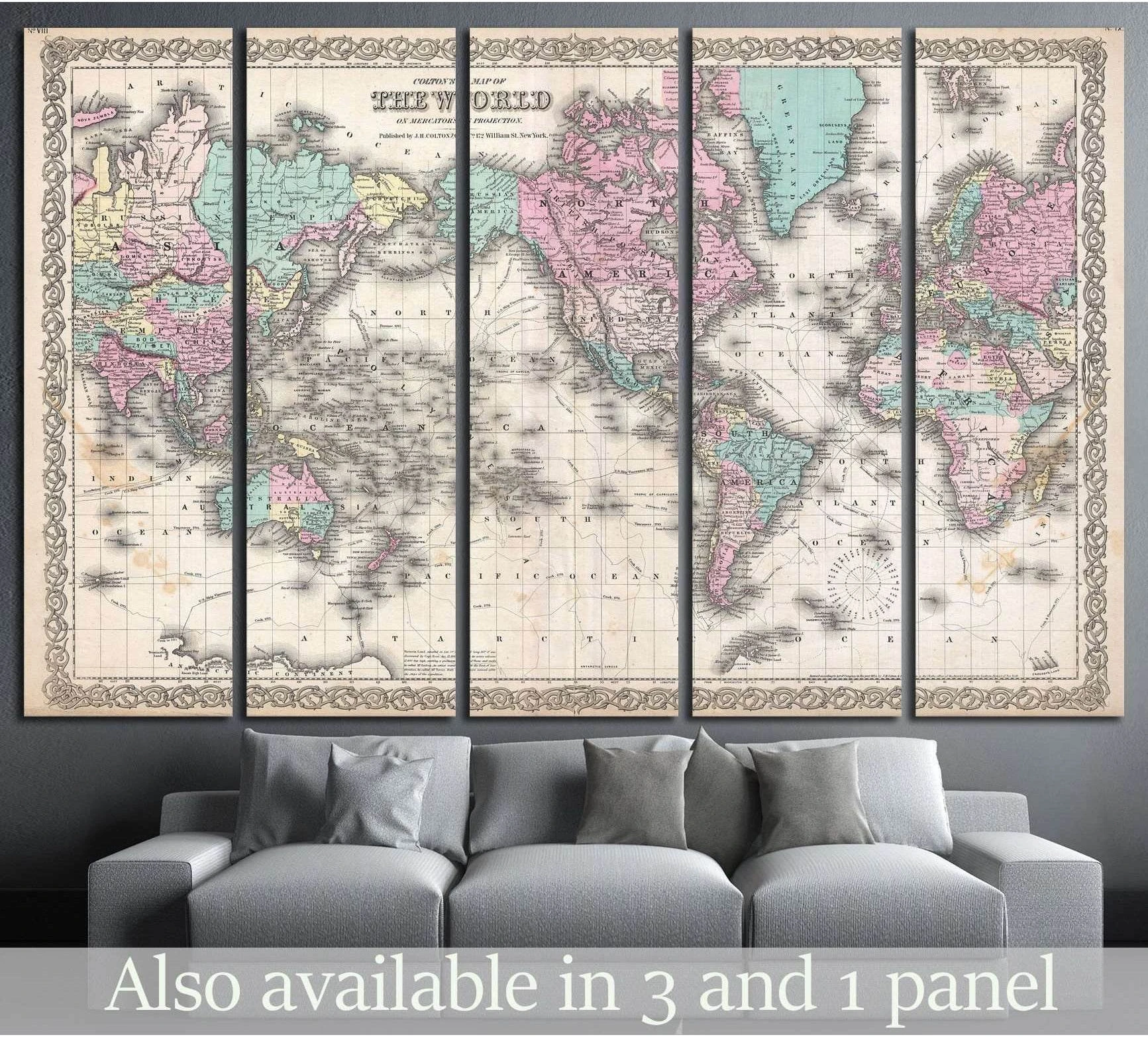 Vintage world map canvas print in pastel antique tones displayed above a gray sofa