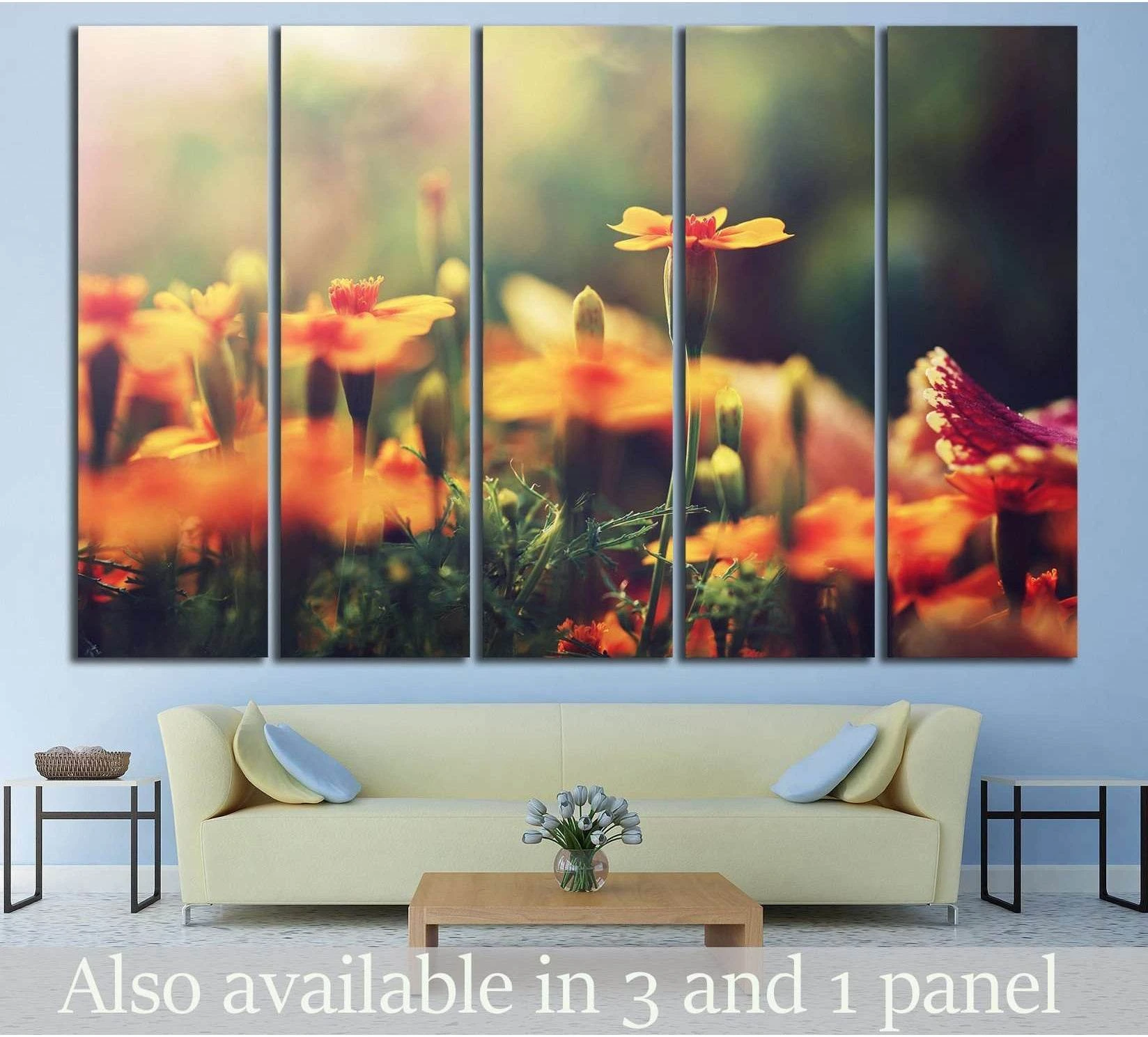 Orange wildflower canvas print in five panels above sofa with soft bokeh meadow blooms