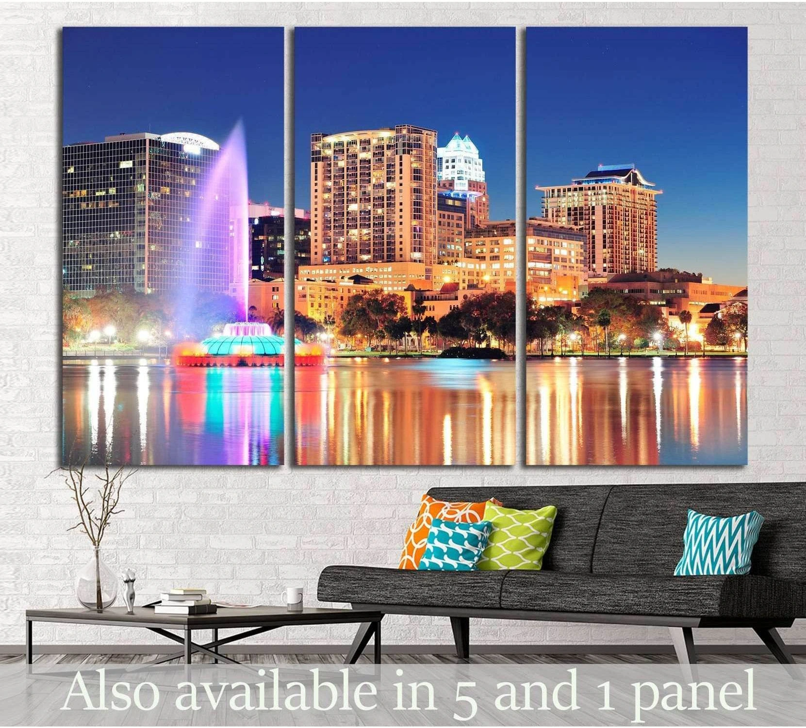 Orlando skyline triptych canvas print with Lake Eola fountain at night above a sofa in a modern living room
