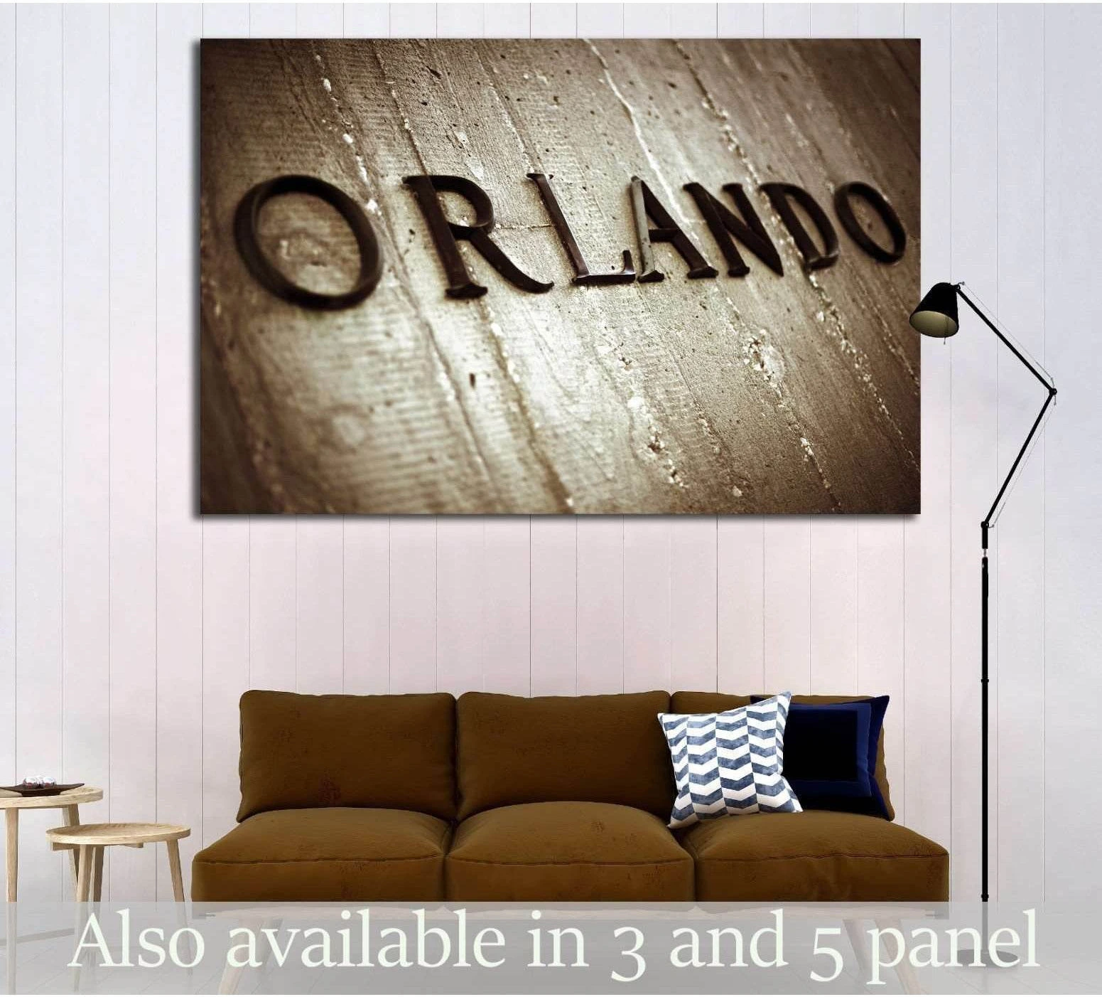 Sepia Orlando sign canvas print with embossed lettering above a sofa in a modern living room