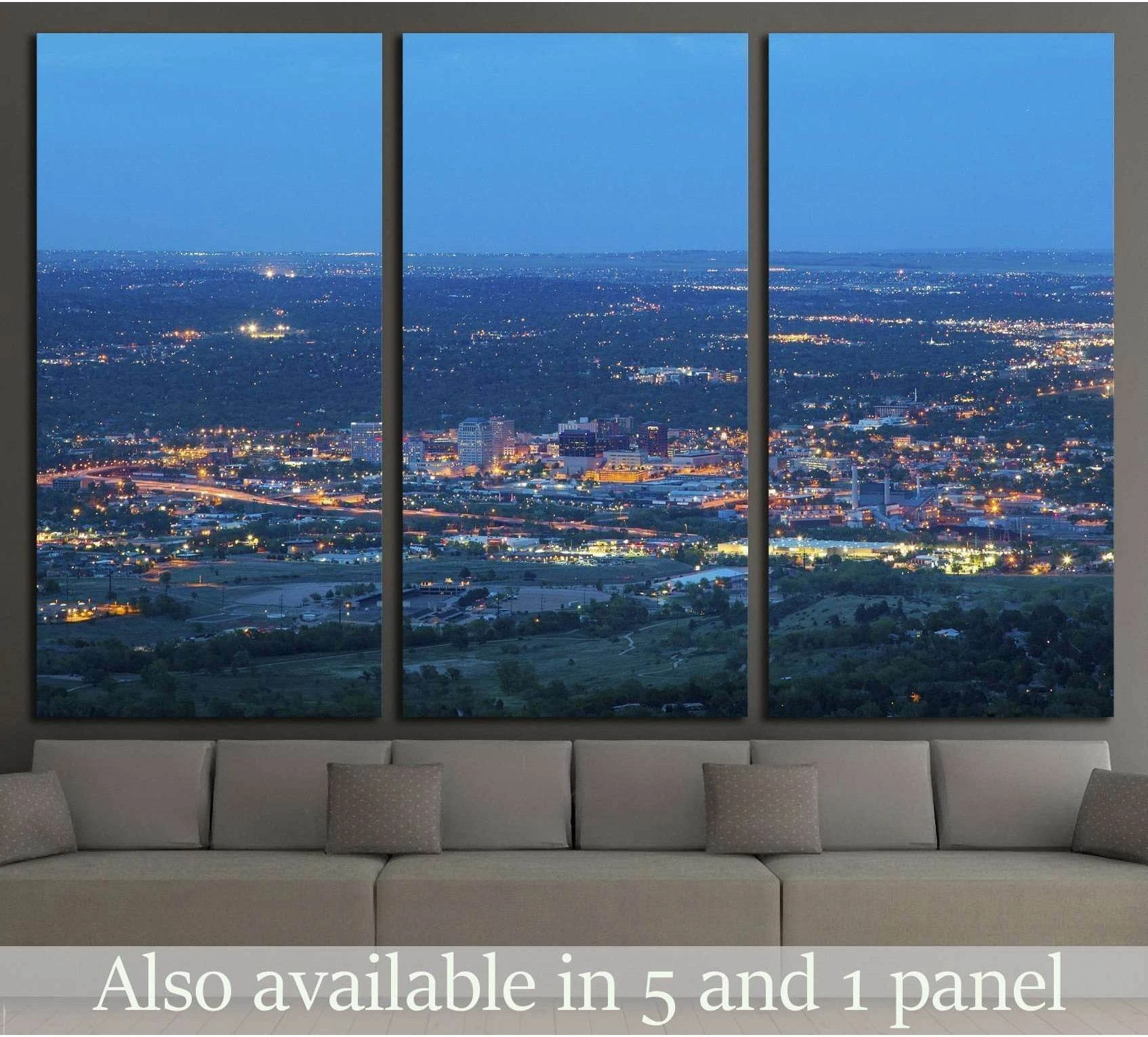 Colorado Springs cityscape canvas print at blue hour shown as a triptych above a sofa