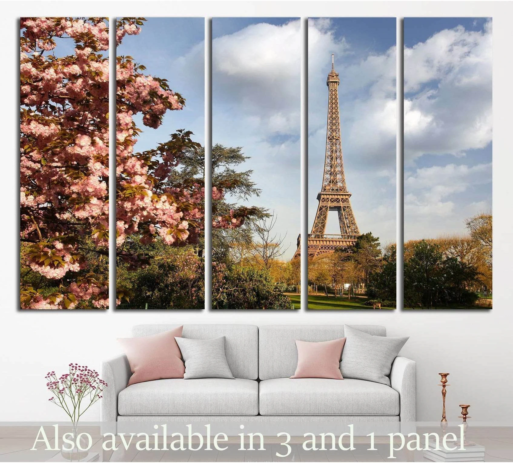 Paris Eiffel Tower canvas print with pink spring blossoms above a sofa in a modern living room
