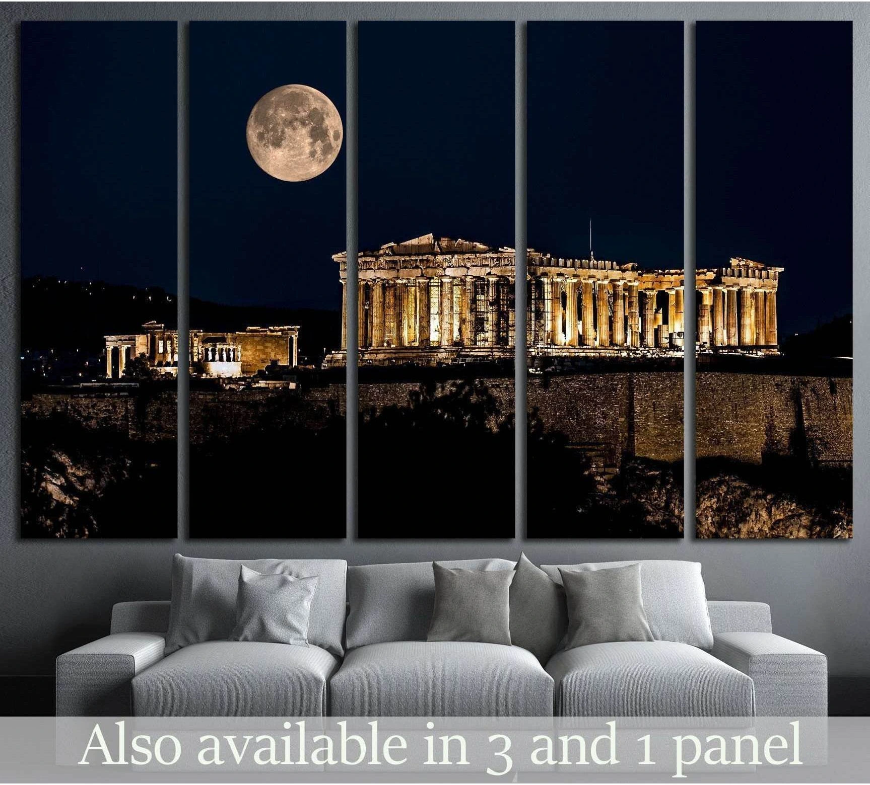 Parthenon canvas print under a full moon at night, displayed above a sofa in a modern living room