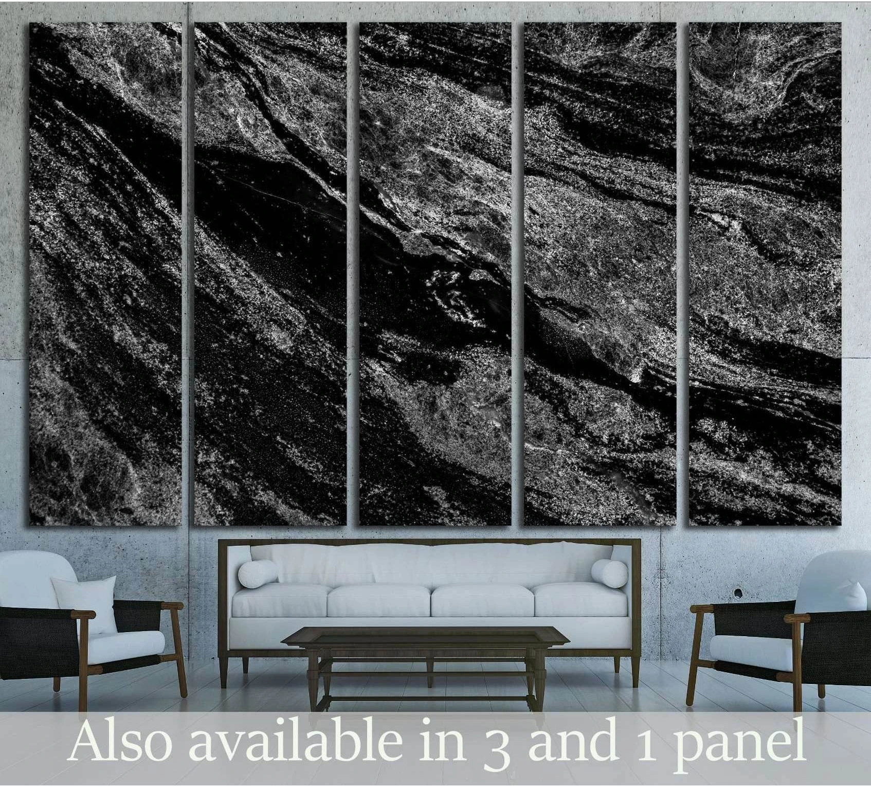 Black marble multi-panel canvas print with white stone veining above a sofa in a modern living room