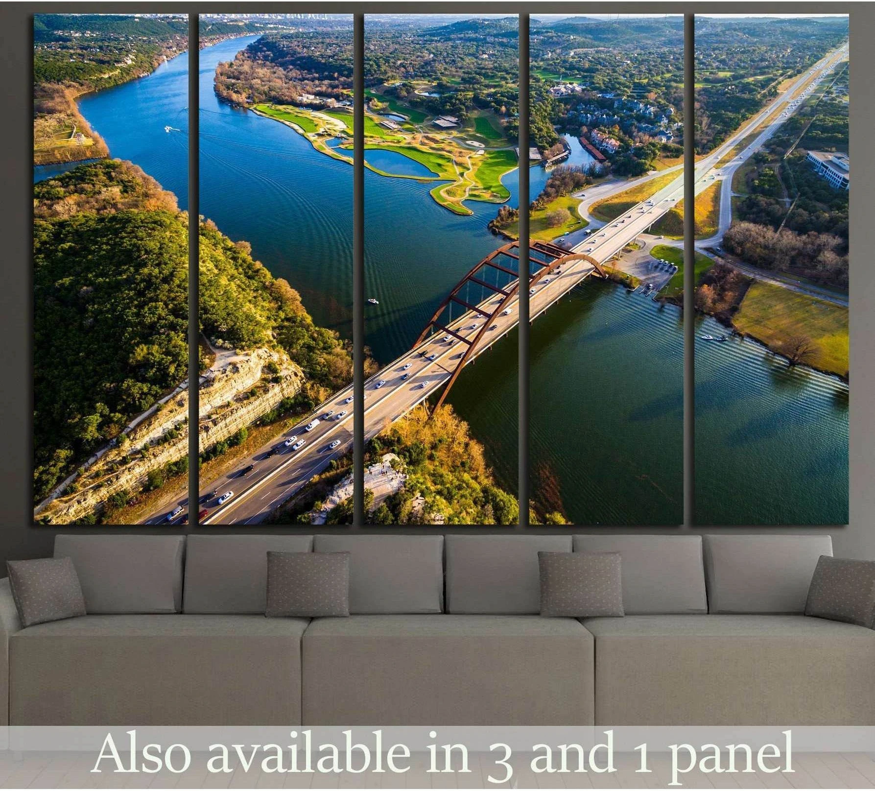 Pennybacker Bridge Austin canvas print with aerial river view hung above sofa in modern living room
