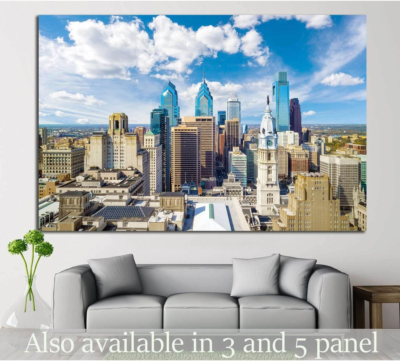 Philadelphia skyline canvas print with City Hall and modern skyscrapers, displayed above a gray sofa