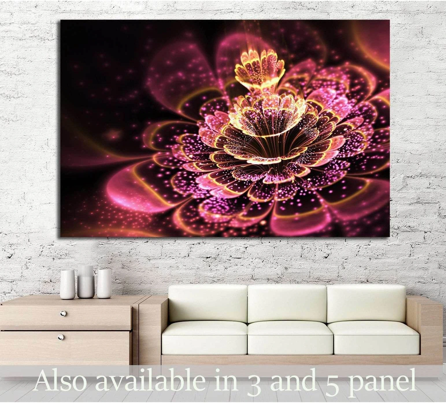 Pink fractal flower canvas print with glowing gold pollen on a dark background above a sofa in a modern living room