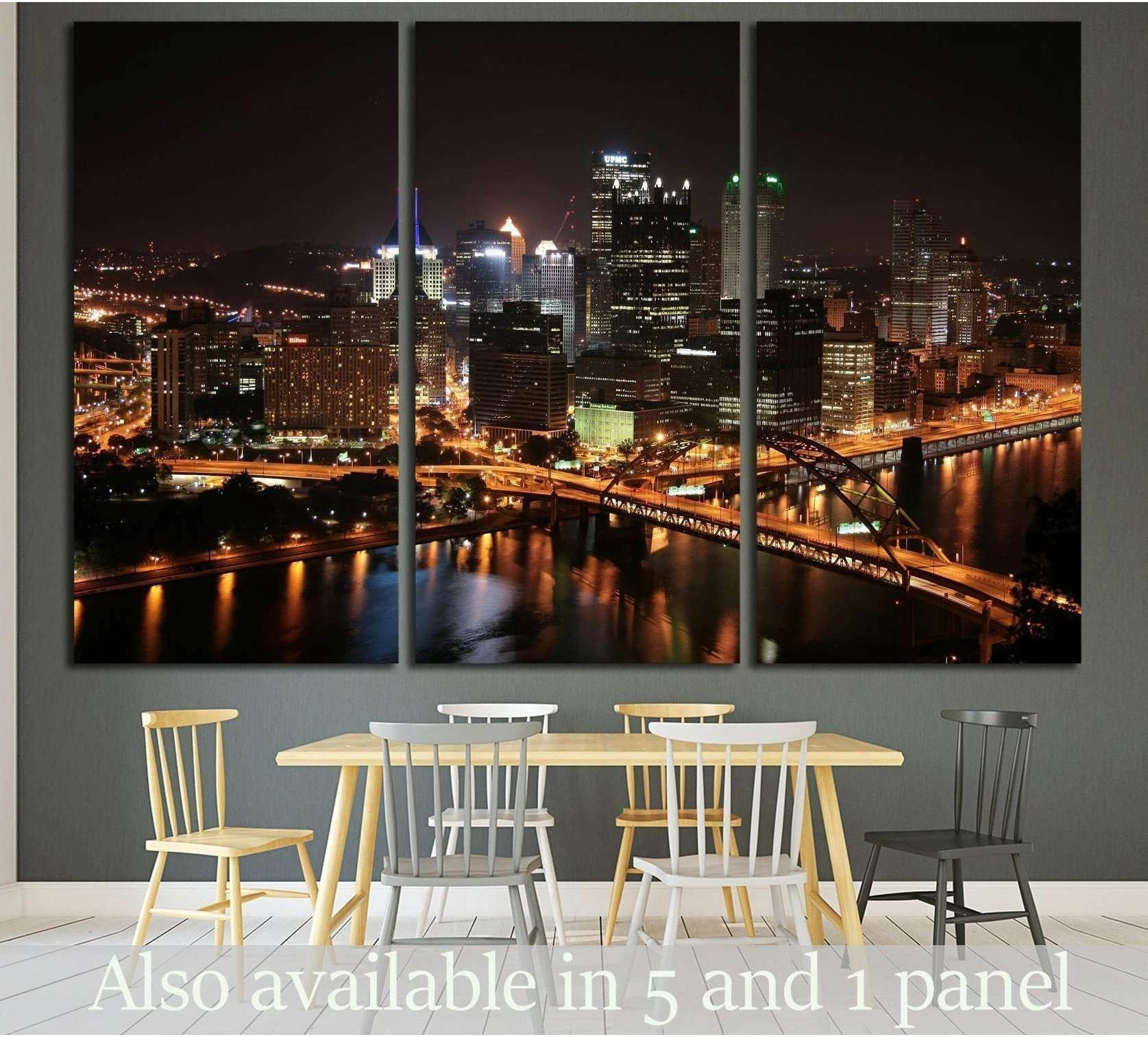 Pittsburgh skyline canvas print at night above a dining table with glowing bridges and river reflections