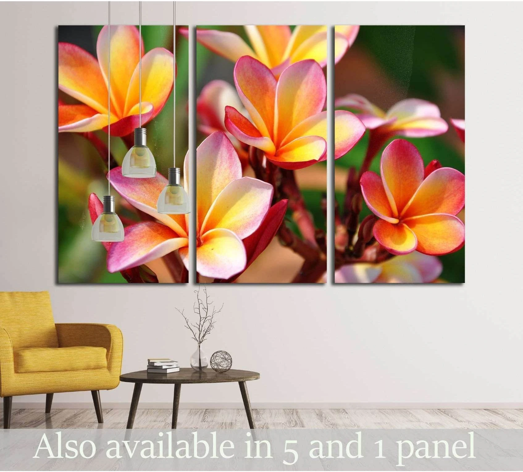 Pink plumeria canvas print triptych with tropical flowers above a chair in a modern living room