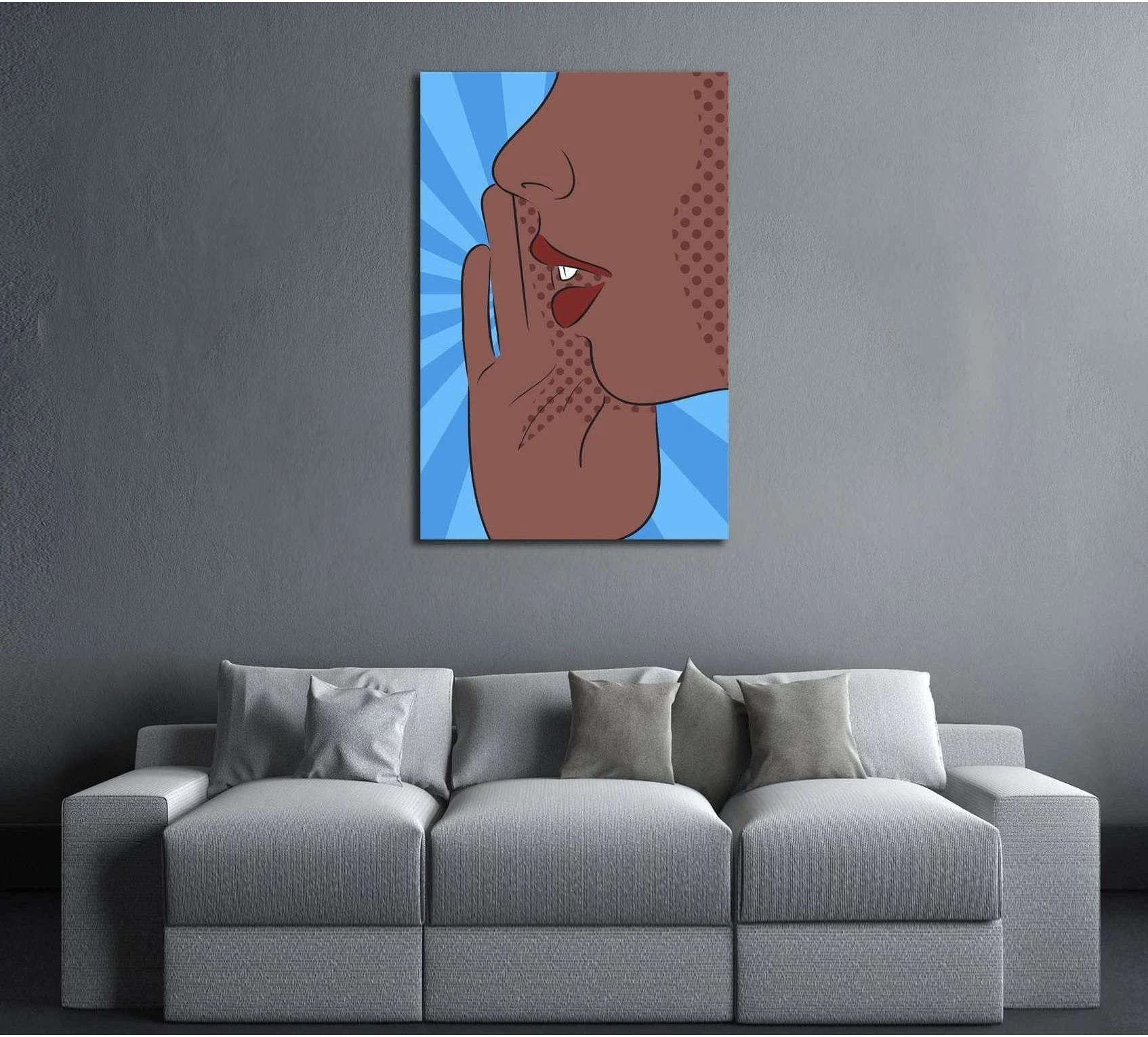 Pop art lips canvas print with shushing portrait and blue burst background above a gray sofa