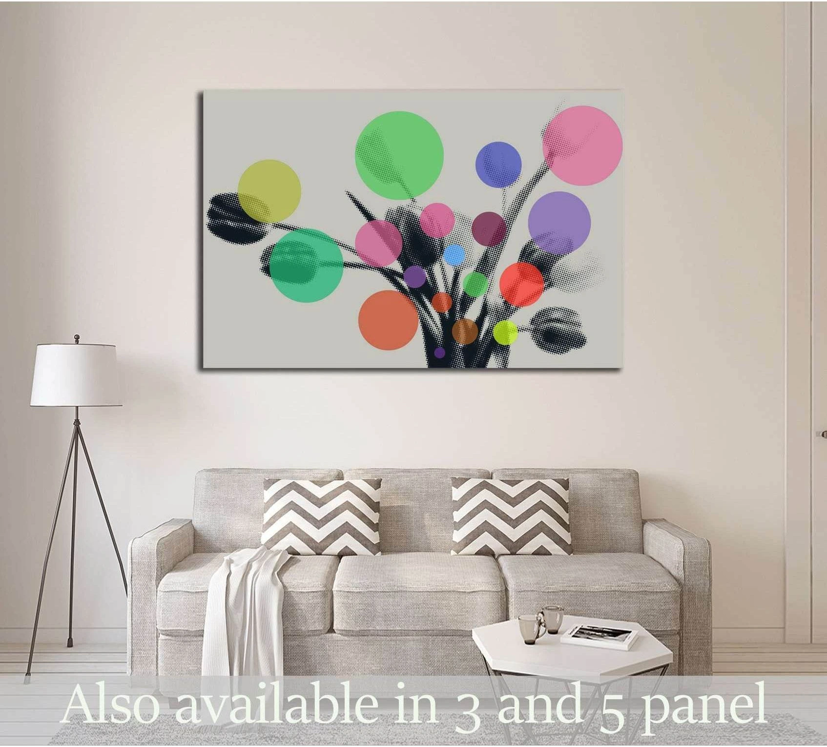 Abstract floral canvas print with colorful circles and black stems above a sofa in a modern living room