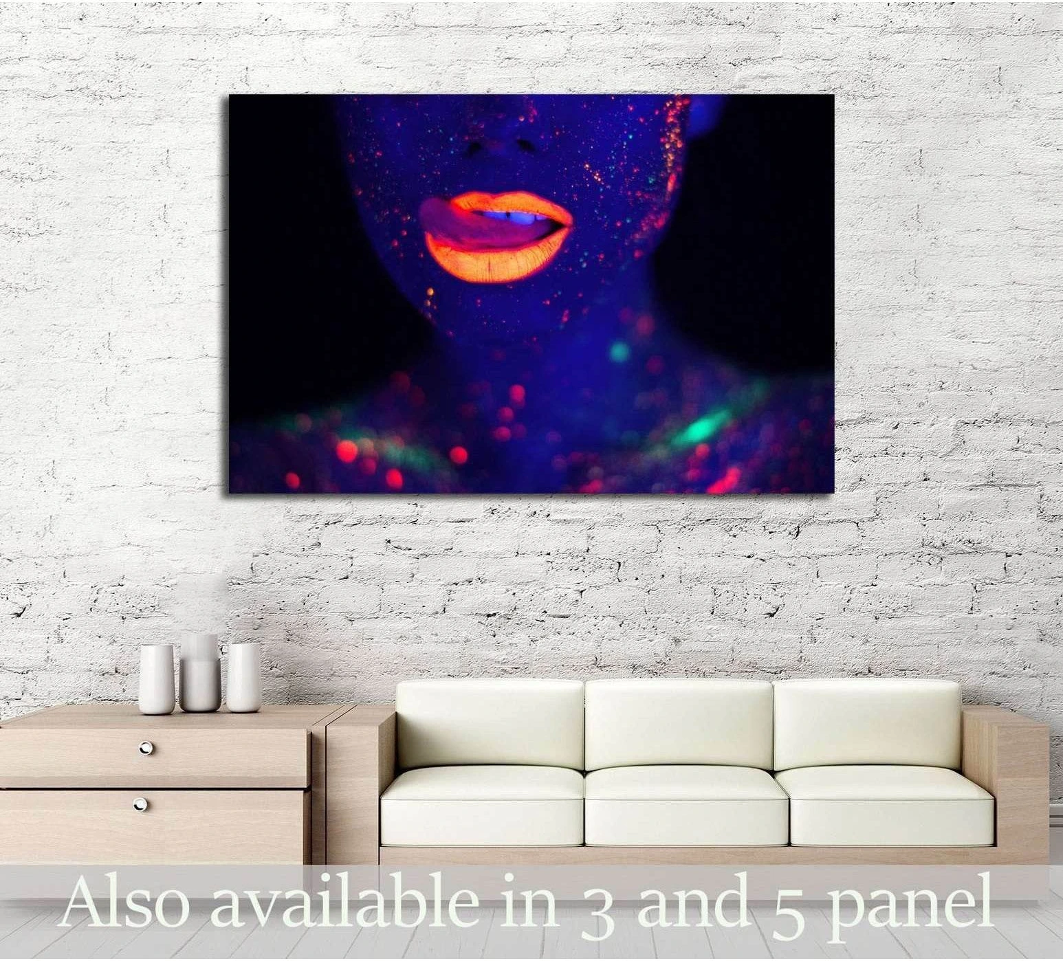 Neon fashion woman portrait canvas print with glowing orange lips above a sofa in a modern room