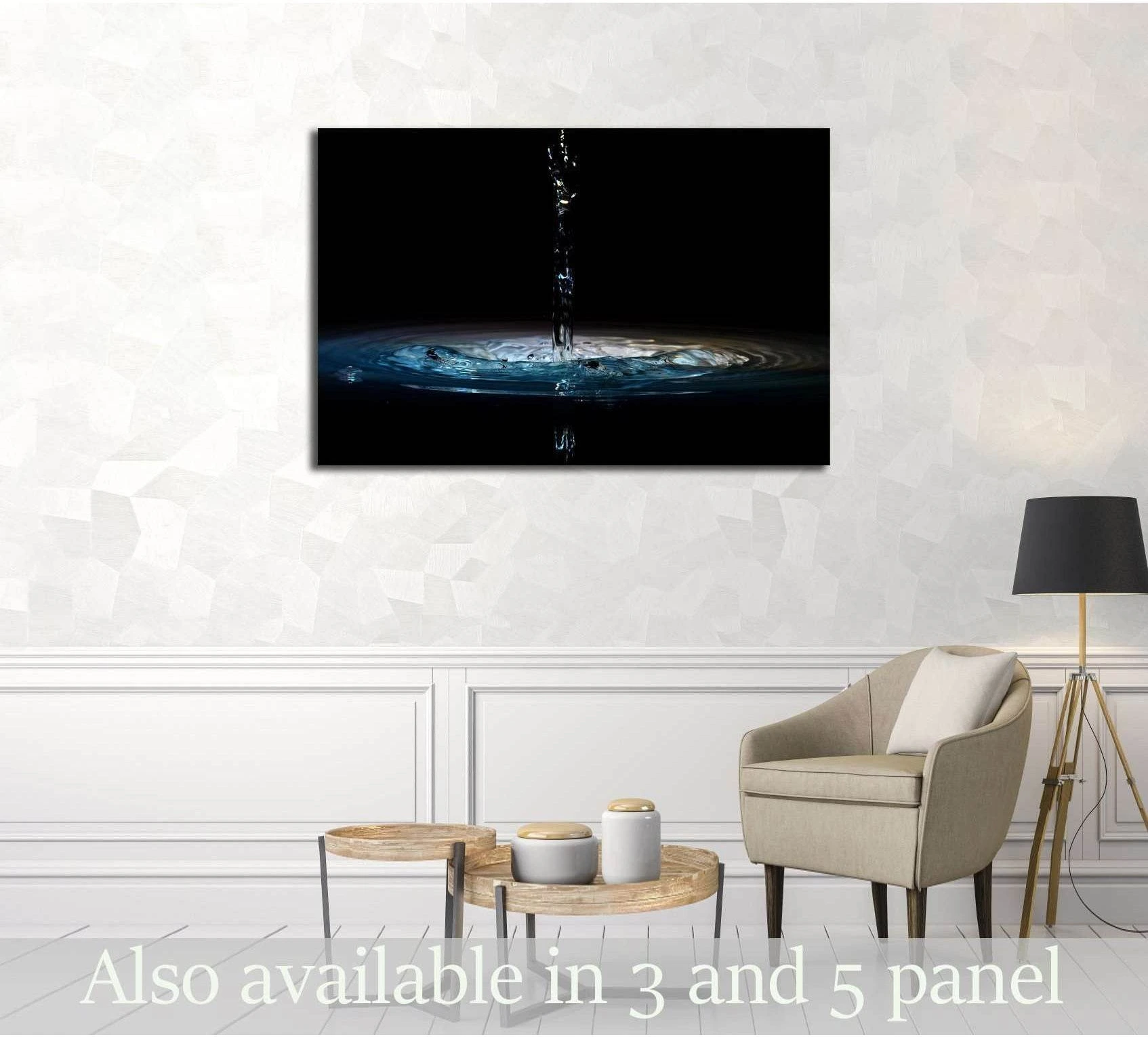 Water splash canvas print above armchair in a modern living room with black background artwork