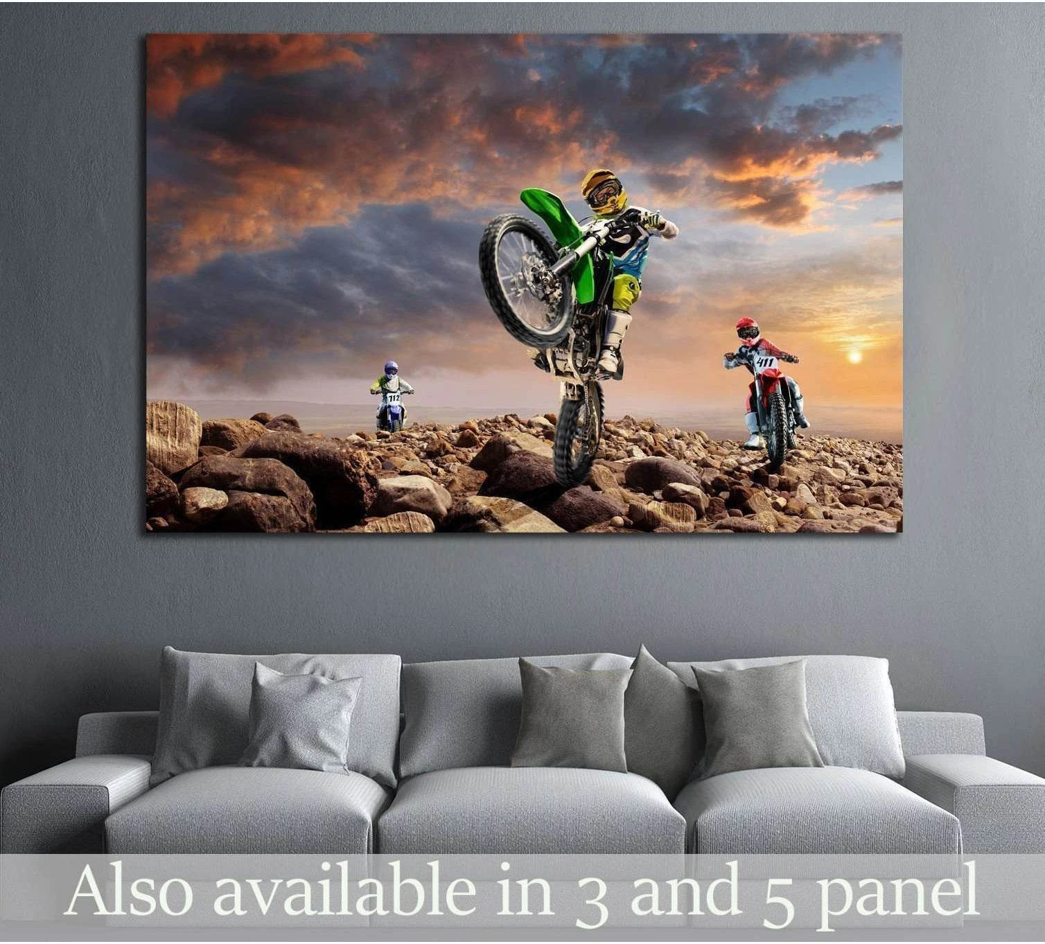 Dirt bike canvas print with motocross riders on rocky terrain at sunset above a sofa
