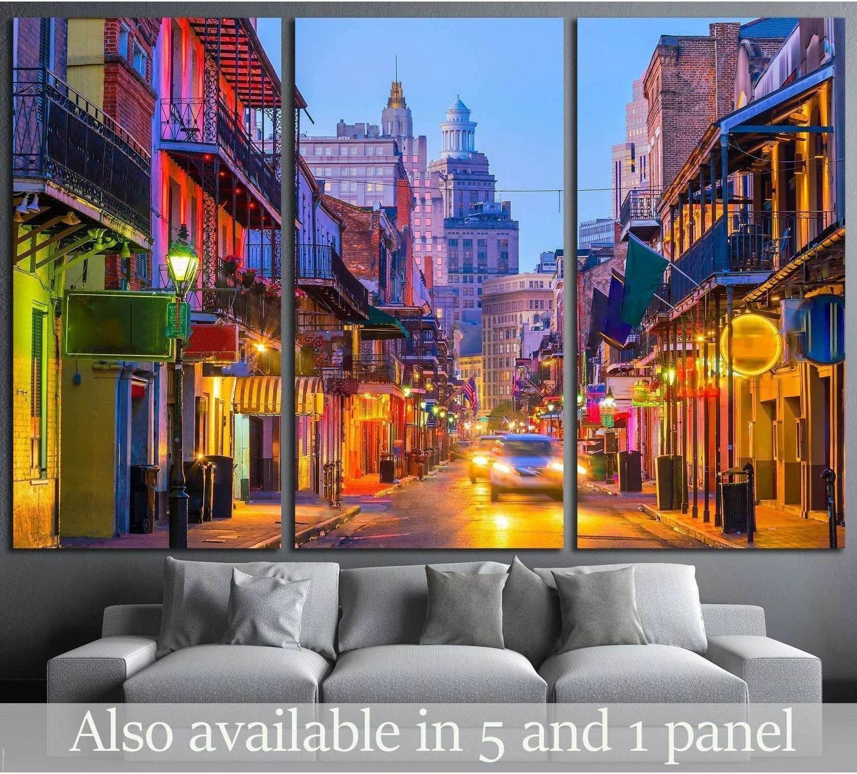 New Orleans French Quarter triptych canvas print with neon-lit street and balconies above a gray sofa