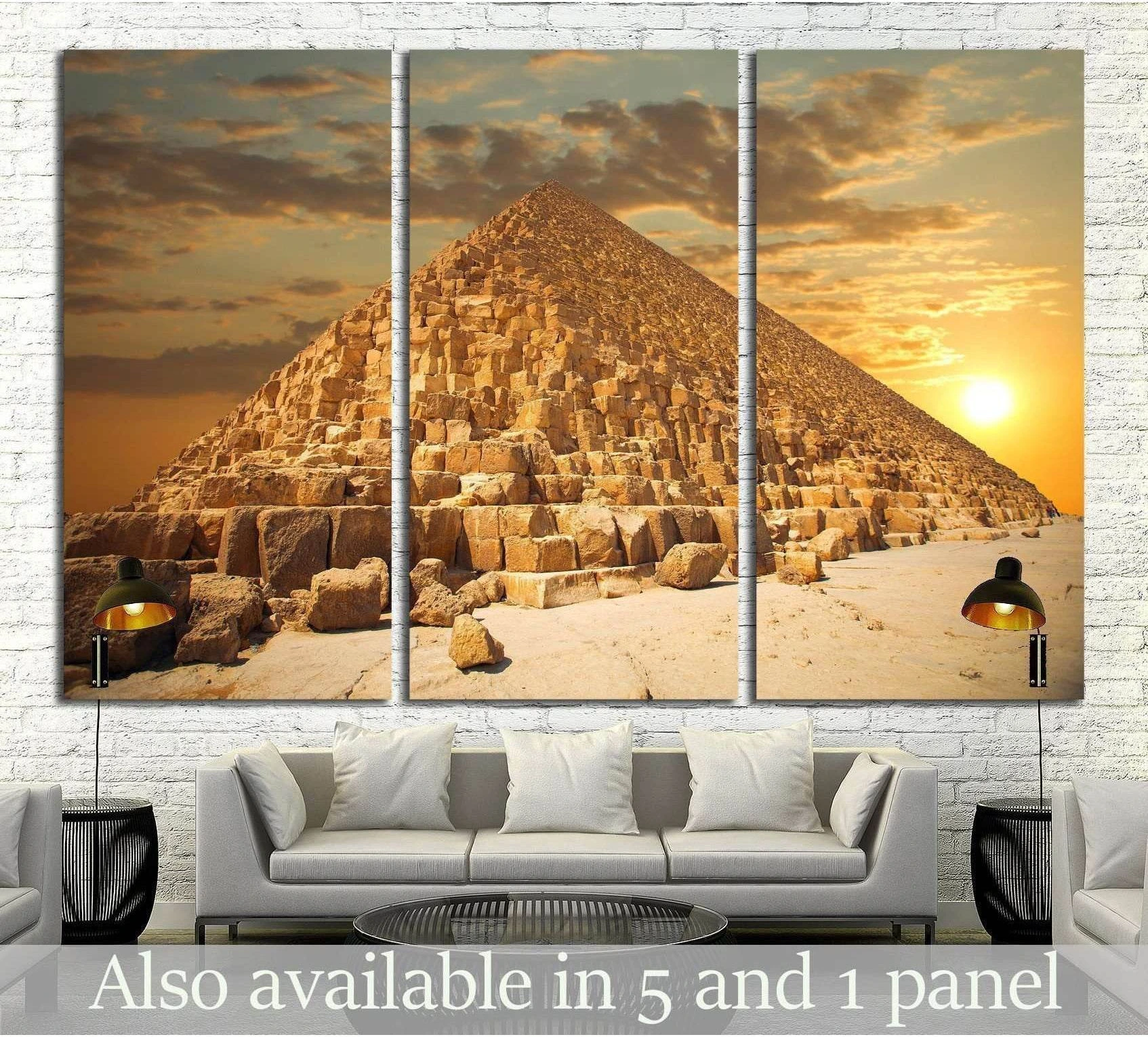 Triptych Pyramids of Giza canvas print with golden sunset sky above a sofa in a modern living room